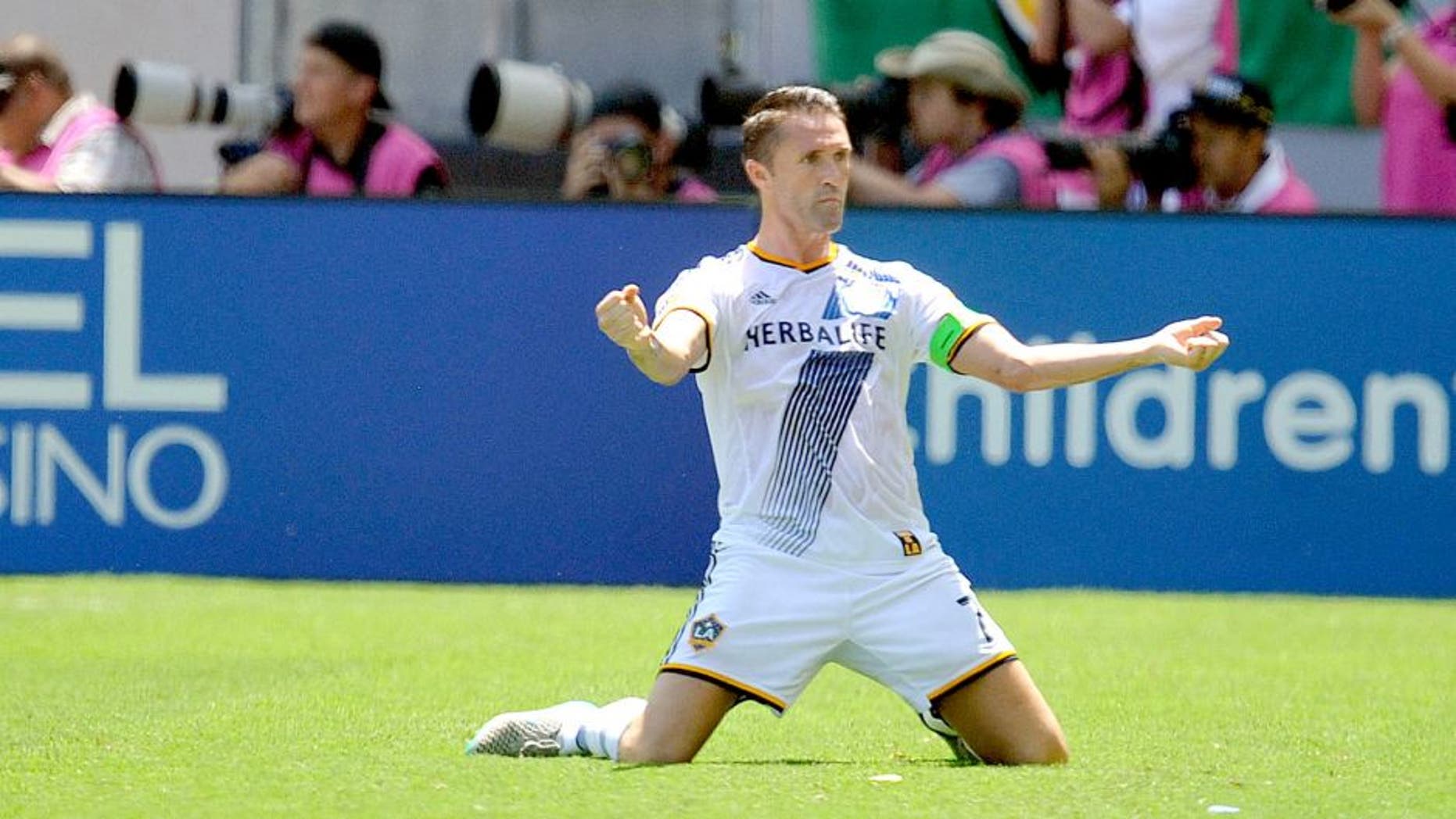 August 23, 2015; Carson, CA, USA; Los Angeles Galaxy forward Robbie Keane (7) reacts to the goal scored by forward Gyasi Zardes (11) against New York City FC during the first half at StubHub Center. Mandatory Credit: Gary A. Vasquez-USA TODAY Sports