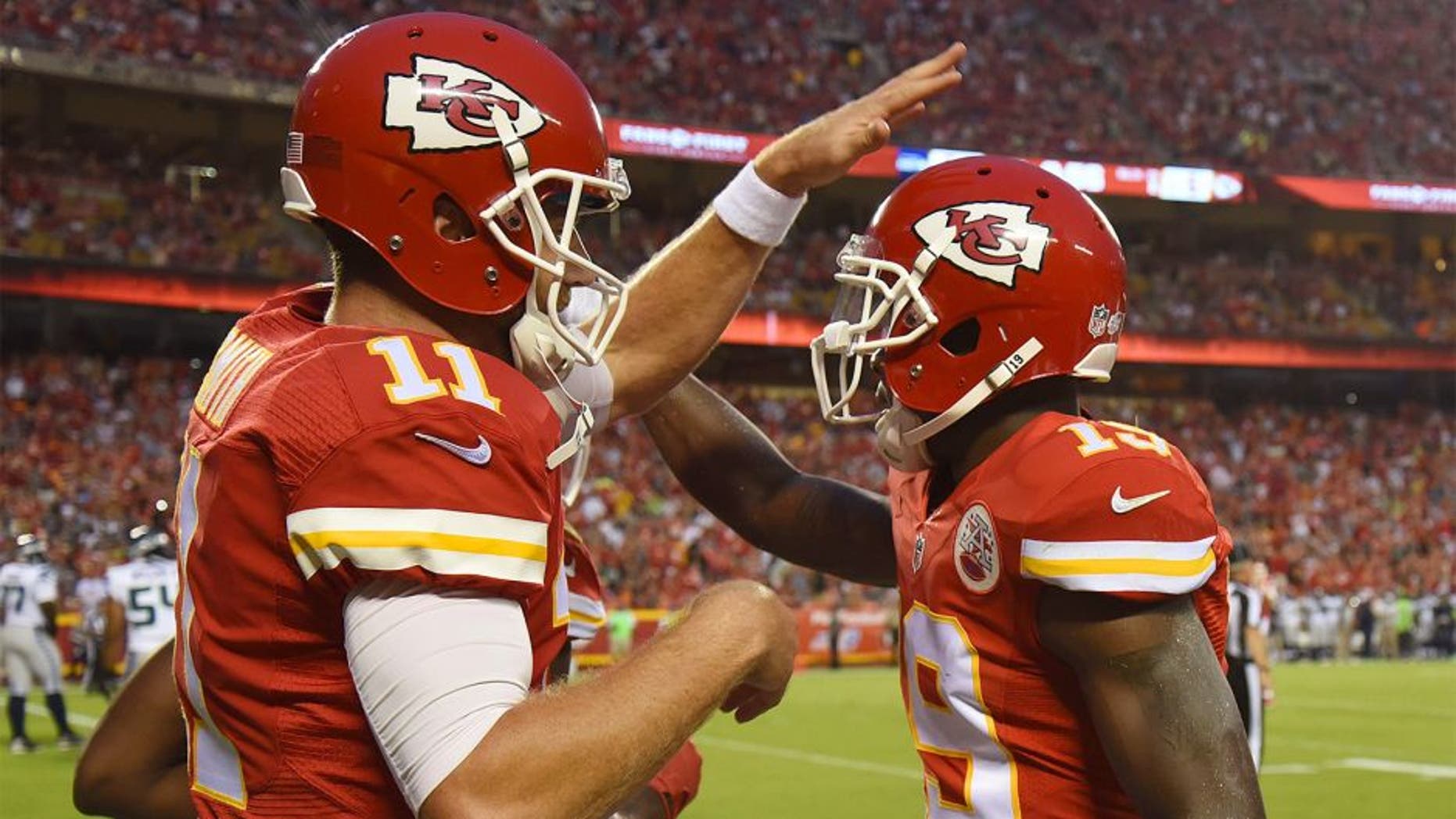 Aug 21, 2015; Kansas City, MO, USA; Kansas City Chiefs wide receiver Jeremy Maclin (19) celebrates with quarterback Alex Smith (11) after catching a touchdown pass against the Seattle Seahawks in the first half at Arrowhead Stadium. Mandatory Credit: John Rieger-USA TODAY Sports