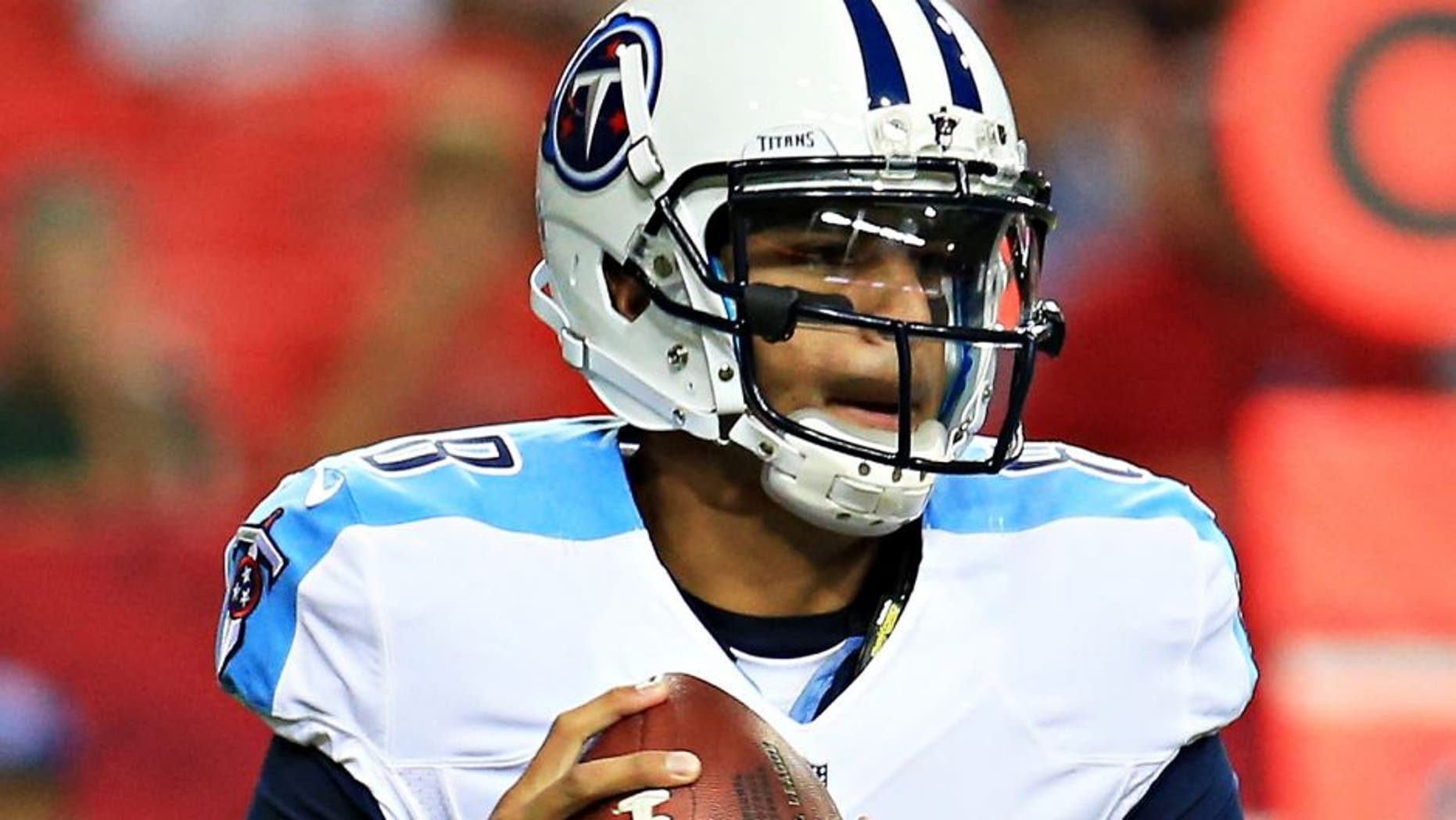 ATLANTA, GA - AUGUST 14: Marcus Mariota #8 of the Tennessee Titans rolls out on a pass play in the first half of a preseason game against the Atlanta Falcons at the Georgia Dome on August 14, 2015 in Atlanta, Georgia. (Photo by Daniel Shirey/Getty Images)