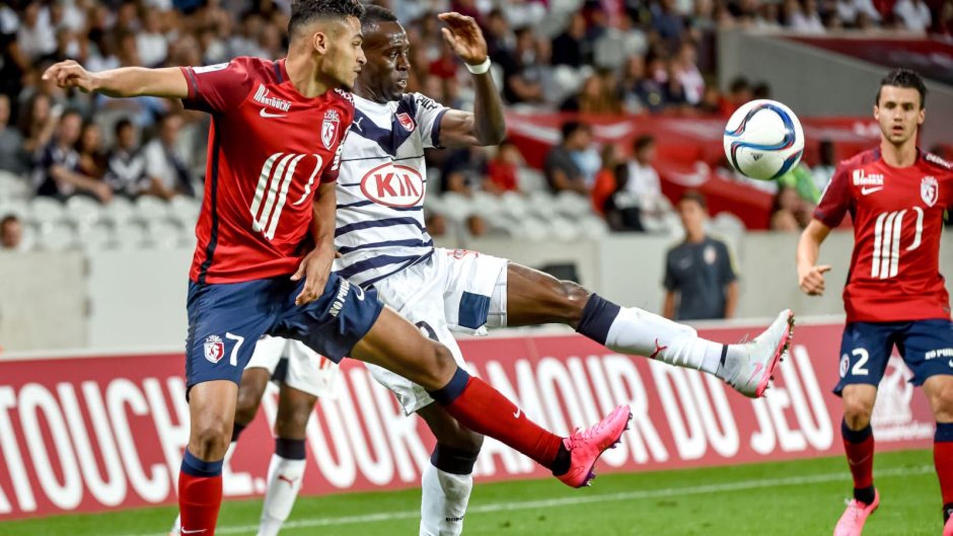 Lille's French midfielder Sofiane Boufal (L) vies with Bordeaux's French defender Maxime Poundje during the French L1 football match between Lille and Bordeaux on August 23, 2015 at the Pierre Mauroy Stadium in Villeneuve d'Ascq, northern france. AFP PHOTO / PHILIPPE HUGUEN (Photo credit should read PHILIPPE HUGUEN/AFP/Getty Images)