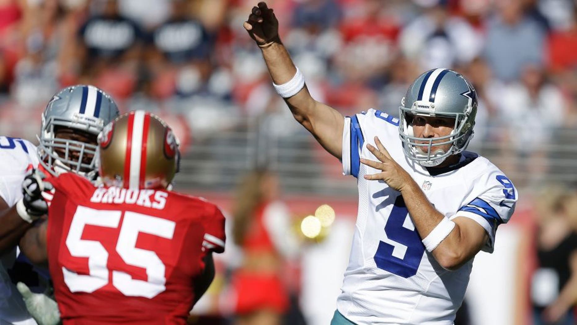 Dallas Cowboys quarterback Tony Romo (9) passes as San Francisco 49ers linebacker Ahmad Brooks (55) applies pressure during the first half of an NFL preseason football game in Santa Clara, Calif., Sunday, Aug. 23, 2015. (AP Photo/Ben Margot)