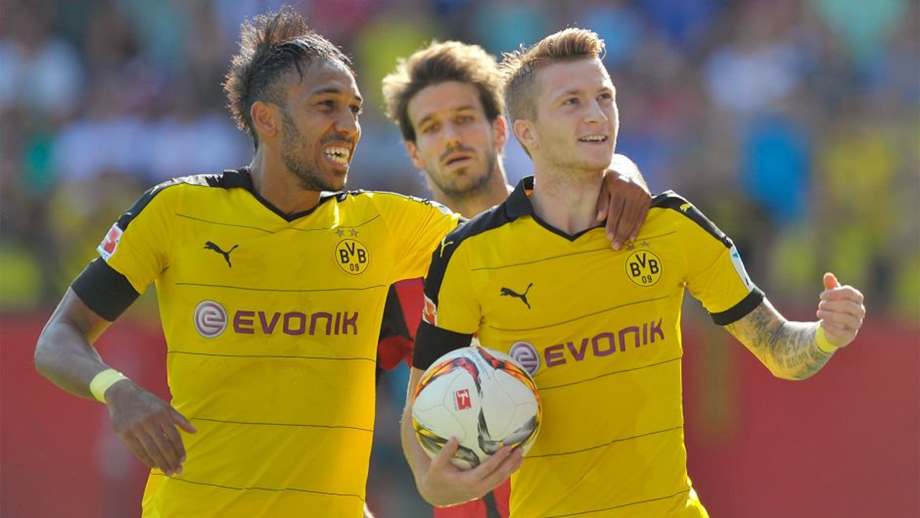 INGOLSTADT, GERMANY - AUGUST 23: Marco Reus (R) and Pierre-Emerick Aubameyang of Borussia Dortmund celebrate their team's second goal during the Bundesliga match between FC Ingolstadt and Borussia Dortmund at Audi Sportpark on August 23, 2015 in Ingolstadt, Germany. (Photo by Lennart Preiss/Bongarts/Getty Images)