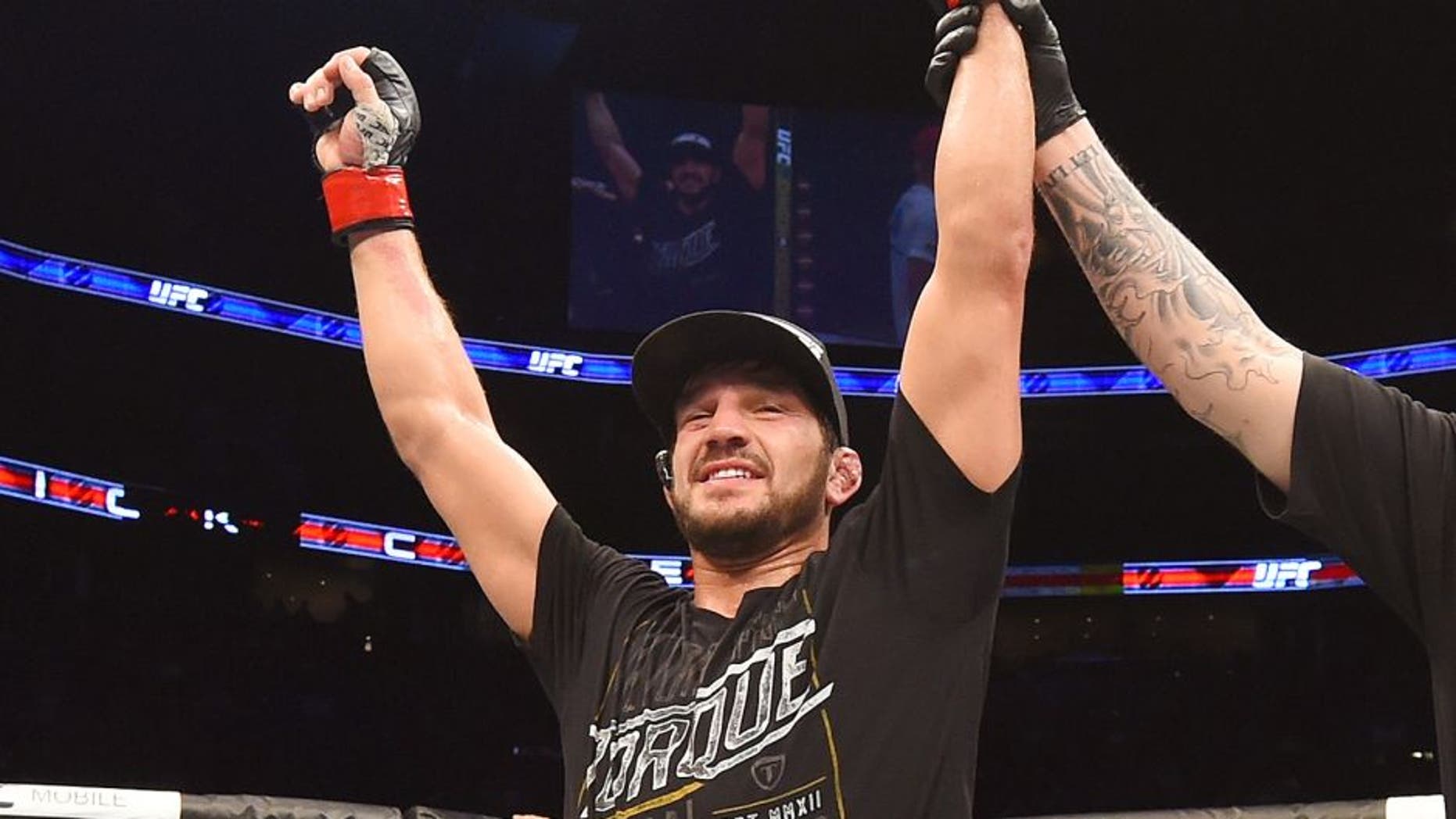 MONTREAL, QC - APRIL 25: Patrick Cote of Canada reacts after his decision victory over Joe Riggs of the United Sates in their welterweight bout during the UFC 186 event at the Bell Centre on April 25, 2015 in Montreal, Quebec, Canada. (Photo by Josh Hedges/Zuffa LLC/Zuffa LLC via Getty Images)