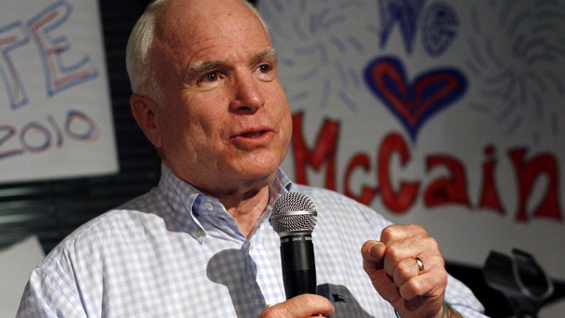 Aug. 23: Sen. John McCain speaks during a campaign stop at his headquarters in Phoenix.