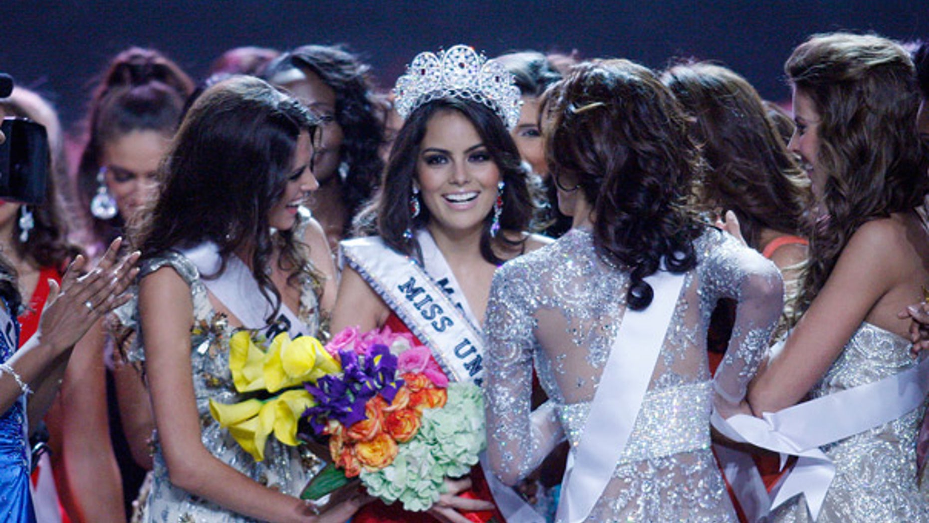 Aug. 23: Jimena Navarrete is congratulated by fellow contestants after being crowned Miss Universe.