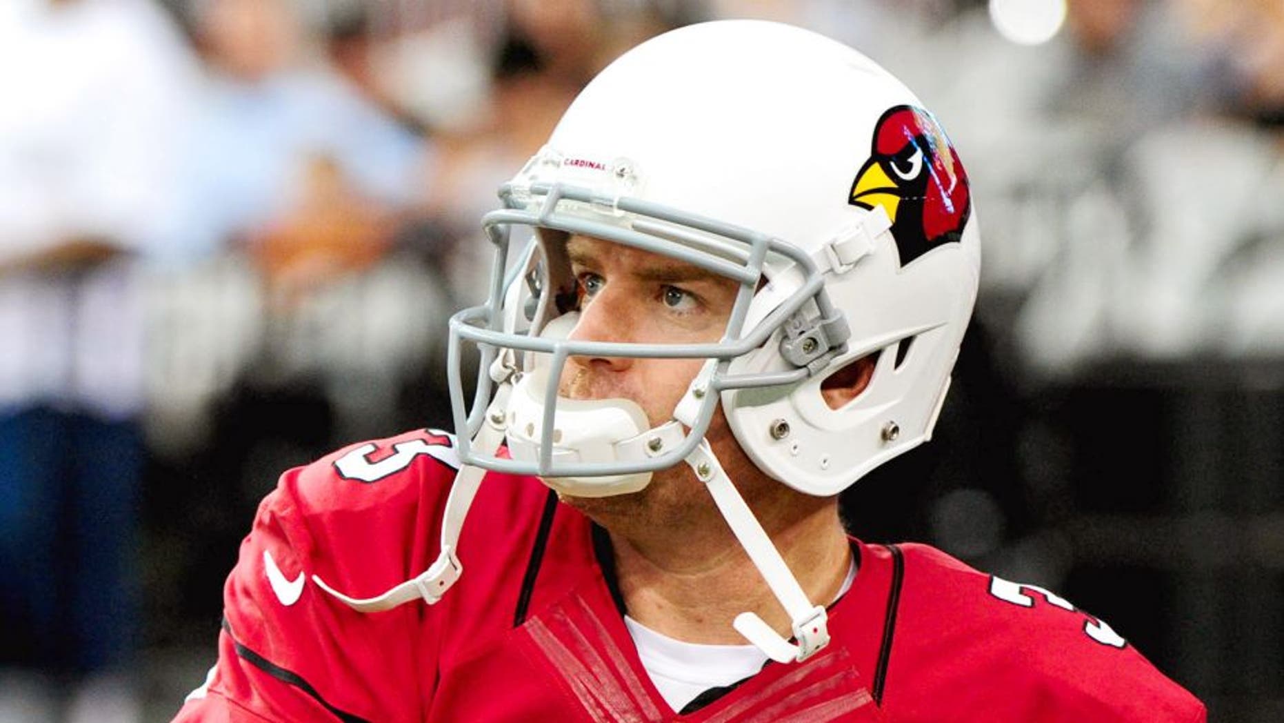 Aug 9, 2014; Glendale, AZ, USA; Arizona Cardinals quarterback Carson Palmer (3) warms up prior to the game against the Houston Texans at University of Phoenix Stadium. Mandatory Credit: Matt Kartozian-USA TODAY Sports
