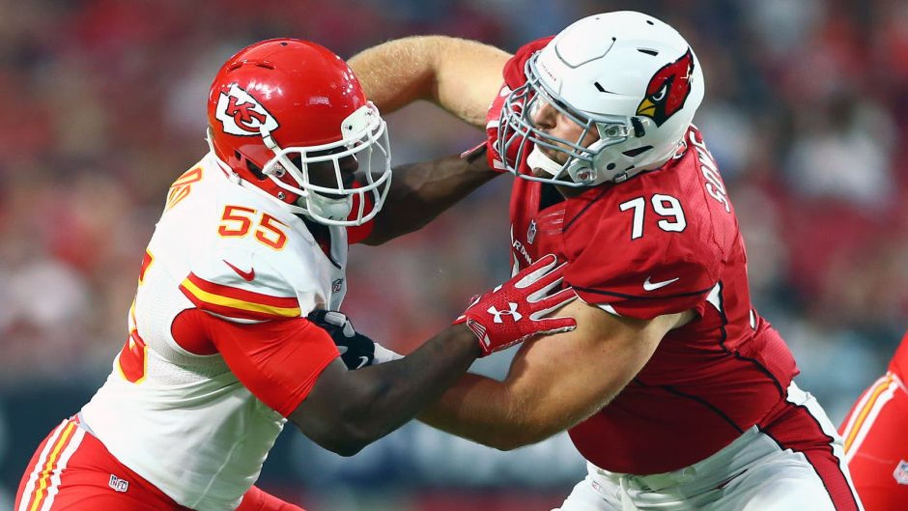 Aug 15, 2015; Glendale, AZ, USA; Kansas City Chiefs linebacker Dee Ford (left) battles against Arizona Cardinals tackle Bradley Sowell during a preseason NFL football game at University of Phoenix Stadium. Mandatory Credit: Mark J. Rebilas-USA TODAY Sports
