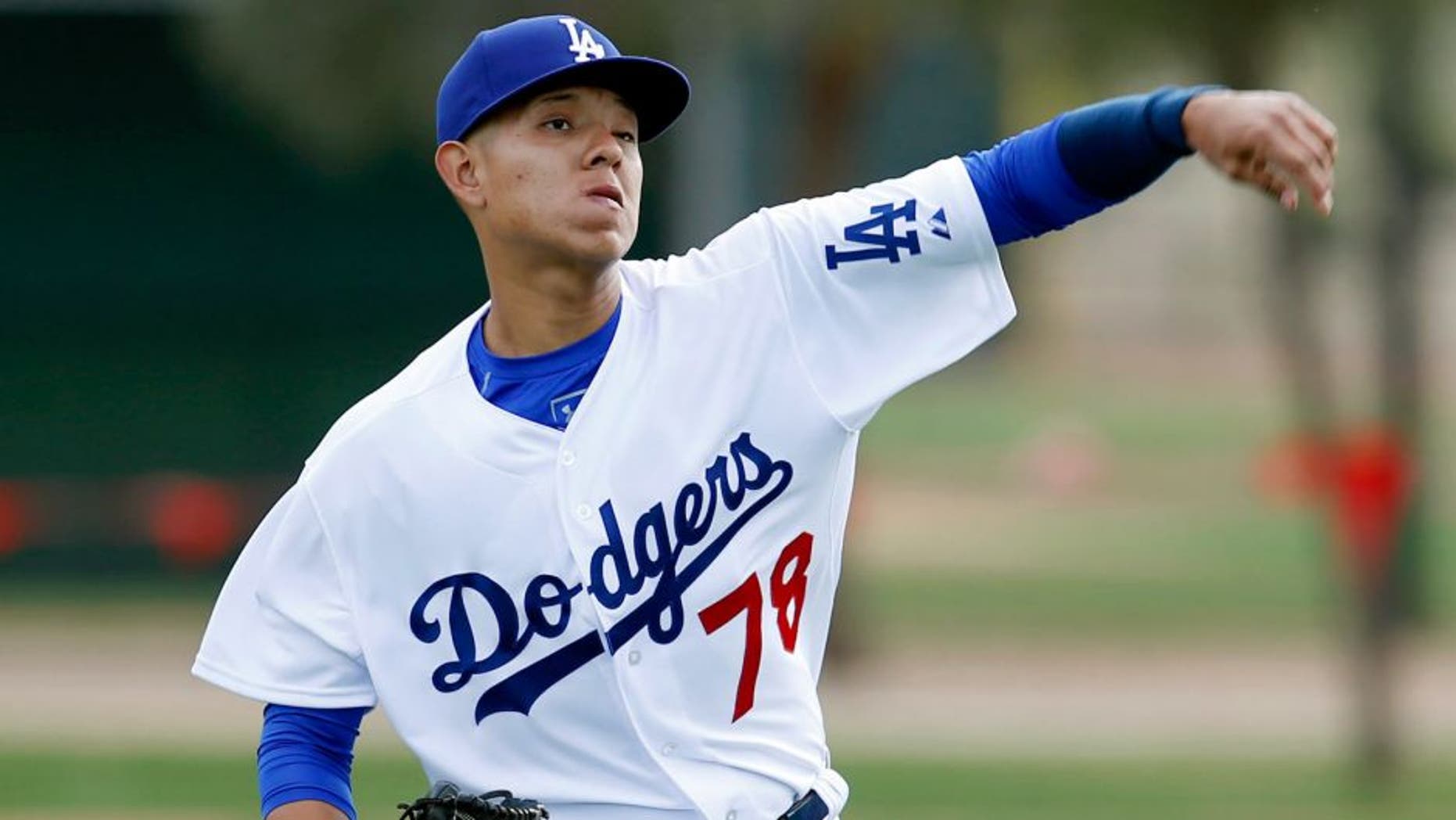 Feb 23, 2015; Glendale, AZ, USA; Los Angeles Dodgers pitcher Julio Urias (78) throws in the bullpen during camp at Camelback Ranch. Mandatory Credit: Rick Scuteri-USA TODAY Sports