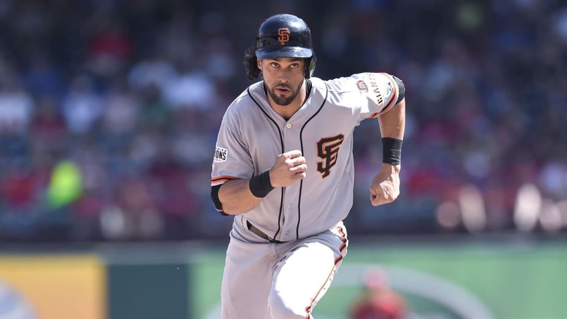 ARLINGTON, TX - AUGUST 02: Angel Pagan #16 of the San Francisco Giants runs the bases as he advances to third base in the game against the Texas Rangers at Globe Life Park in Arlington on August 2, 2015 in Arlington, Texas. The Texas Rangers defeated the San Francisco Giants 2-1. (Photo by John Williamson/MLB Photos via Getty Images)