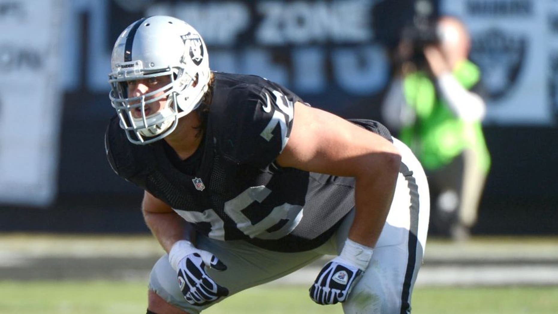November 24, 2013; Oakland, CA, USA; Oakland Raiders guard Lucas Nix (76) at the line of scrimmage during the second quarter against the Tennessee Titans at O.co Coliseum. The Titans defeated the Raiders 23-19. Mandatory Credit: Kyle Terada-USA TODAY Sports