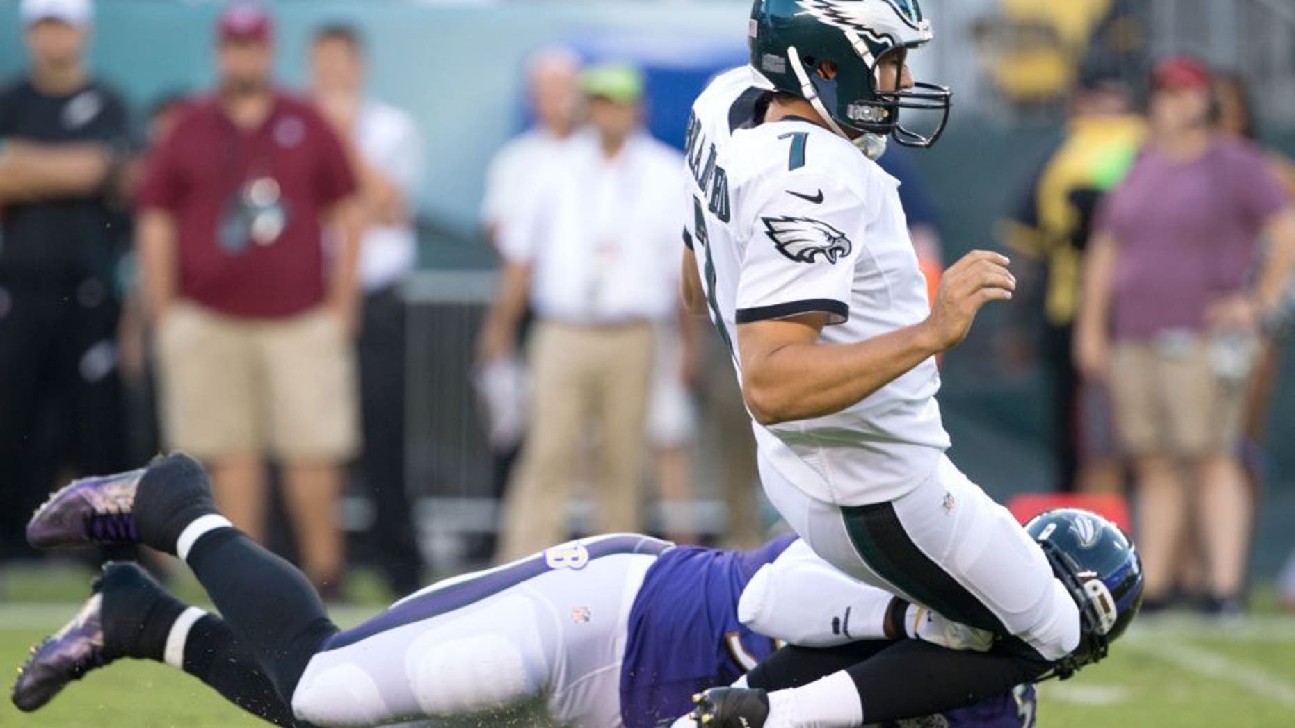 Aug 22, 2015; Philadelphia, PA, USA; Baltimore Ravens outside linebacker Terrell Suggs (55) tackles Philadelphia Eagles quarterback Sam Bradford (7) late and is called for a penalty during the first quarter at Lincoln Financial Field. Mandatory Credit: Bill Streicher-USA TODAY Sports