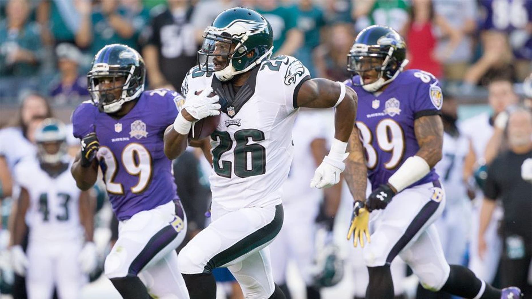 Aug 22, 2015; Philadelphia, PA, USA; Philadelphia Eagles defensive back Walter Thurmond (26) runs with the ball after an interception against the Baltimore Ravens during the first quarter at Lincoln Financial Field. Mandatory Credit: Bill Streicher-USA TODAY Sports