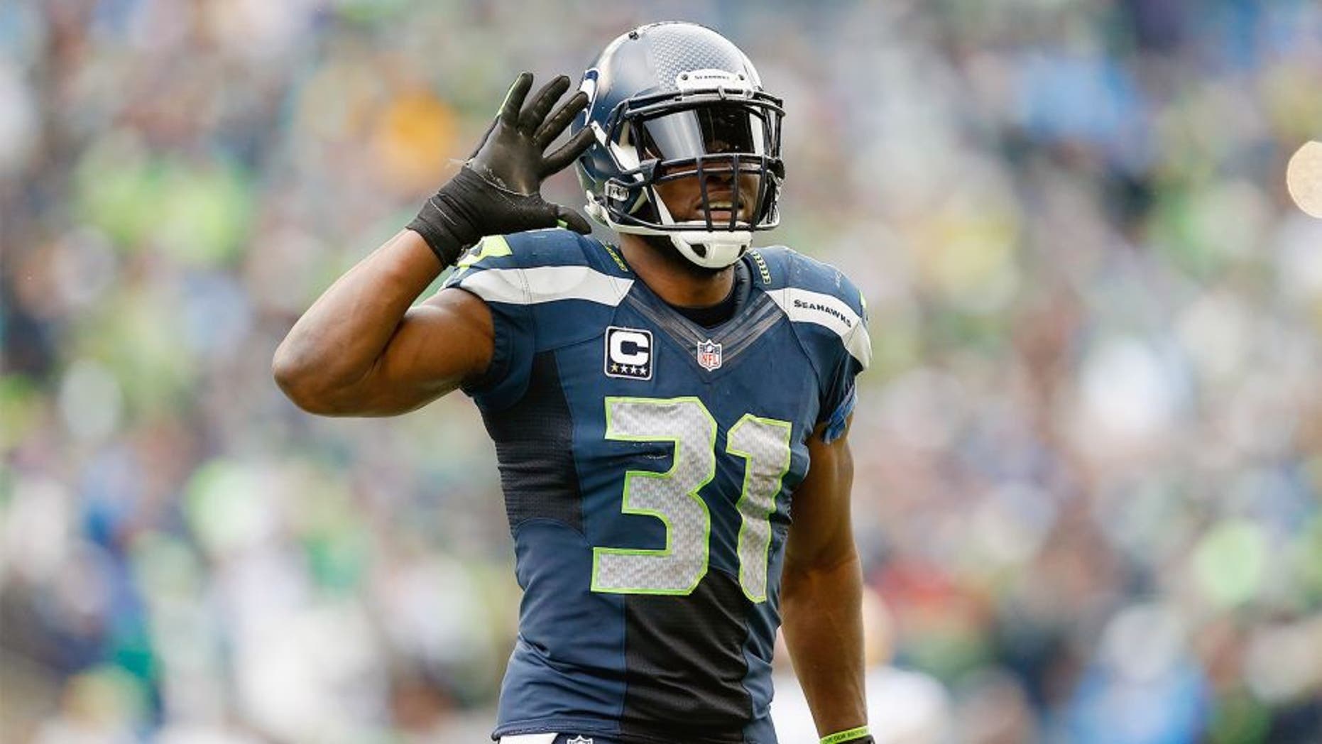 SEATTLE, WA - JANUARY 18: Strong safety Kam Chancellor #31 of the Seattle Seahawks reacts in the 2015 NFC Championship game against the Green Bay Packers at CenturyLink Field on January 18, 2015 in Seattle, Washington. The Seahawks defeated the Packers 28-22 in overtime. (Photo by Christian Petersen/Getty Images)
