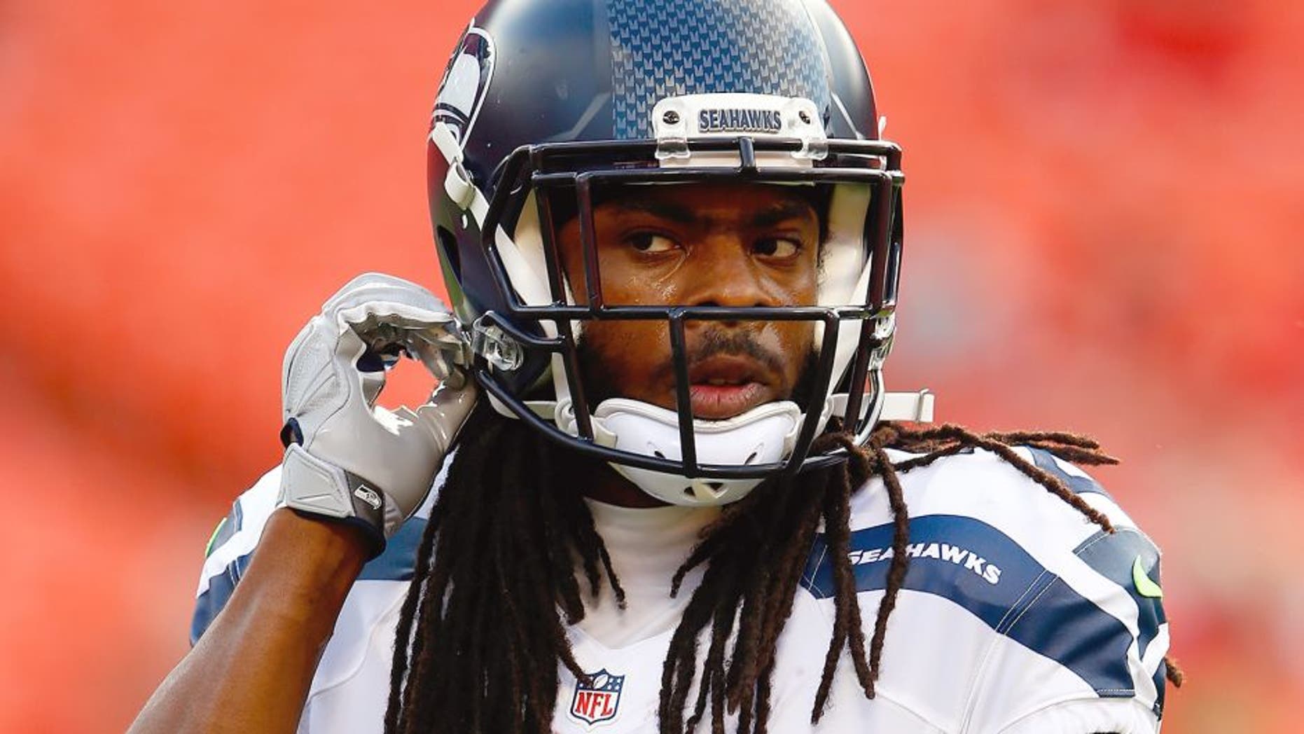 KANSAS CITY, MO - AUGUST 21: Cornerback Richard Sherman #25 of the Seattle Seahawks warms up prior to the start of the preaseason game against the Kansas City Chiefs at Arrowhead Stadium on August 21, 2015 in Kansas City, Missouri. (Photo by Jamie Squire/Getty Images)