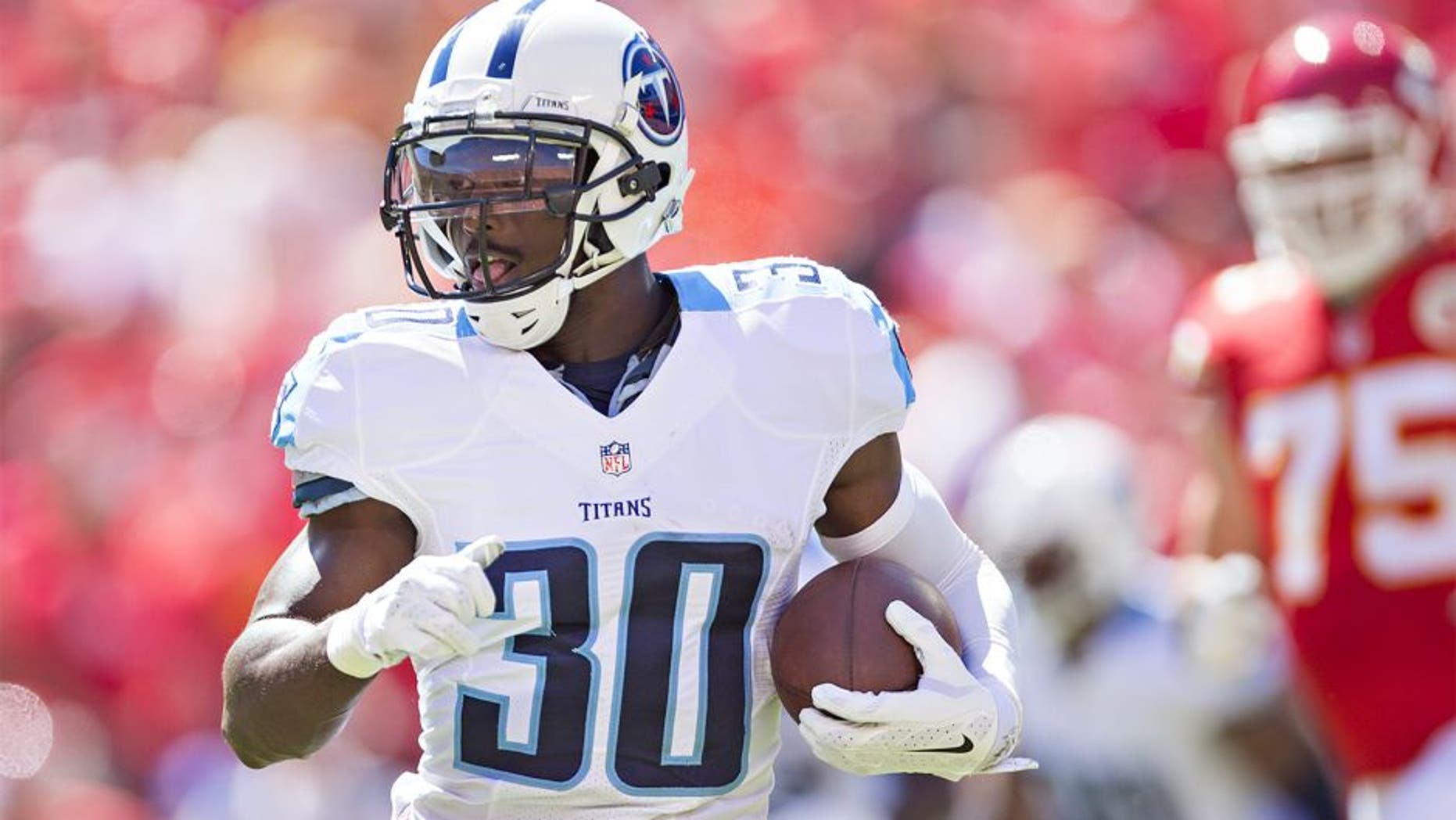 KANSAS CITY, MO - SEPTEMBER 7: Jason McCourty #30 of the Tennessee Titans runs the ball during a game against the Kansas City Chiefs at Arrowhead Stadium on September 7, 2014 in Kansas City, Missouri. The Titans defeated the Chiefs 26-10. (Photo by Wesley Hitt/Getty Images)