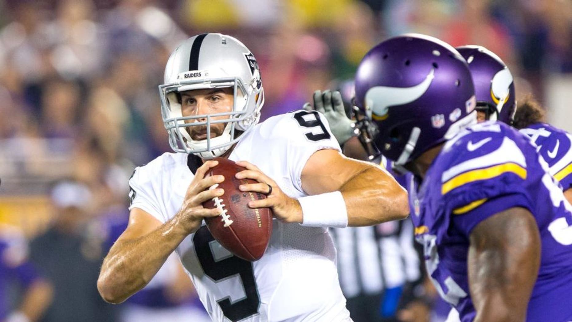 Aug 22, 2015; Minneapolis, MN, USA; Oakland Raiders quarterback Christian Ponder (9) scrambles in the third quarter against the Minnesota Vikings at TCF Bank Stadium. The Minnesota Vikings beat the Oakland Raiders 20-12. Mandatory Credit: Brad Rempel-USA TODAY Sports