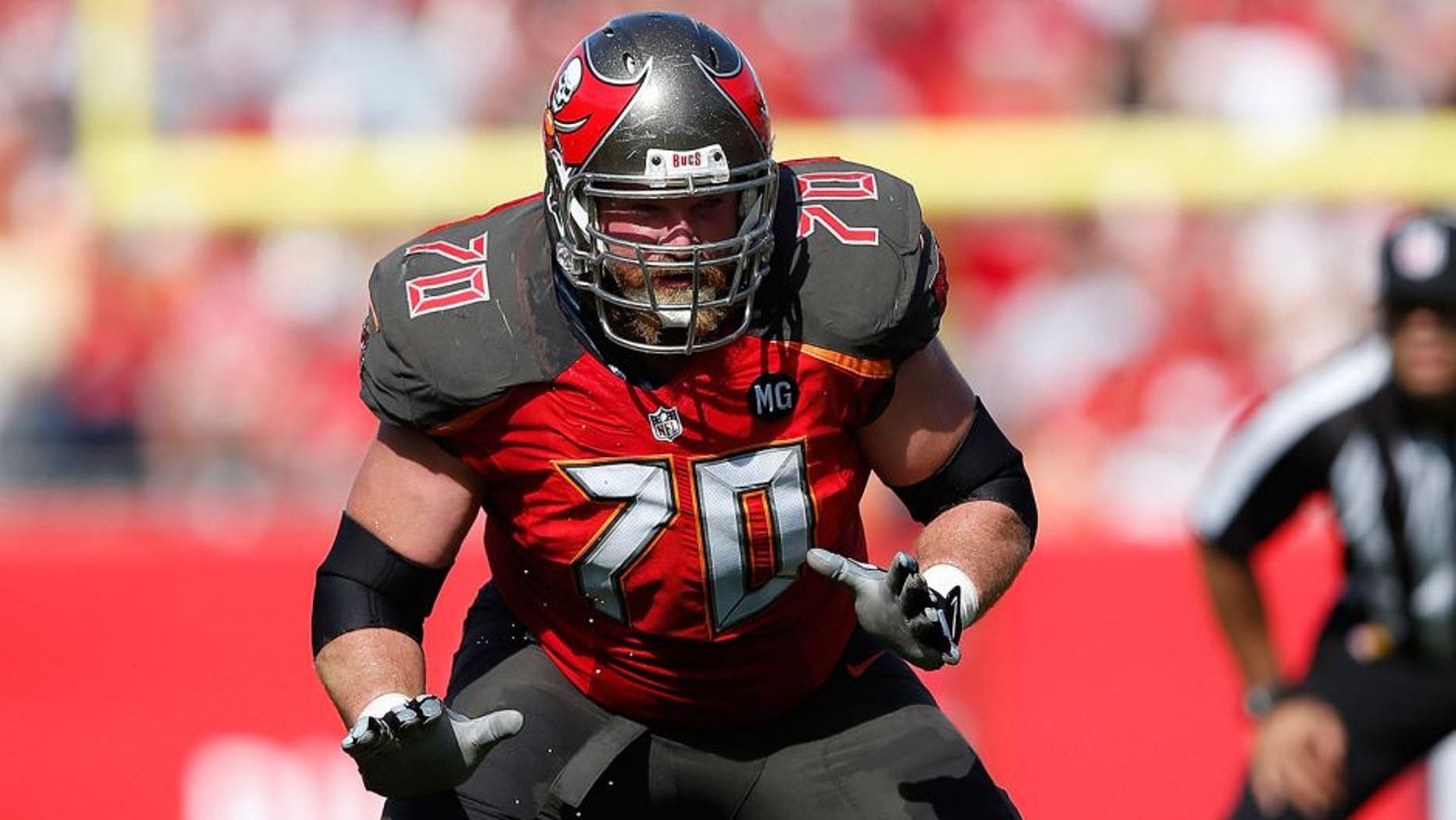 TAMPA, FL - DECEMBER 28: Logan Mankins #70 of the Tampa Bay Buccaneers blocks against the New Orleans Saints during the game at Raymond James Stadium on December 28, 2014 in Tampa, Florida. The Saints defeated the Bucs 23-20. (Photo by Joe Robbins/Getty Images)