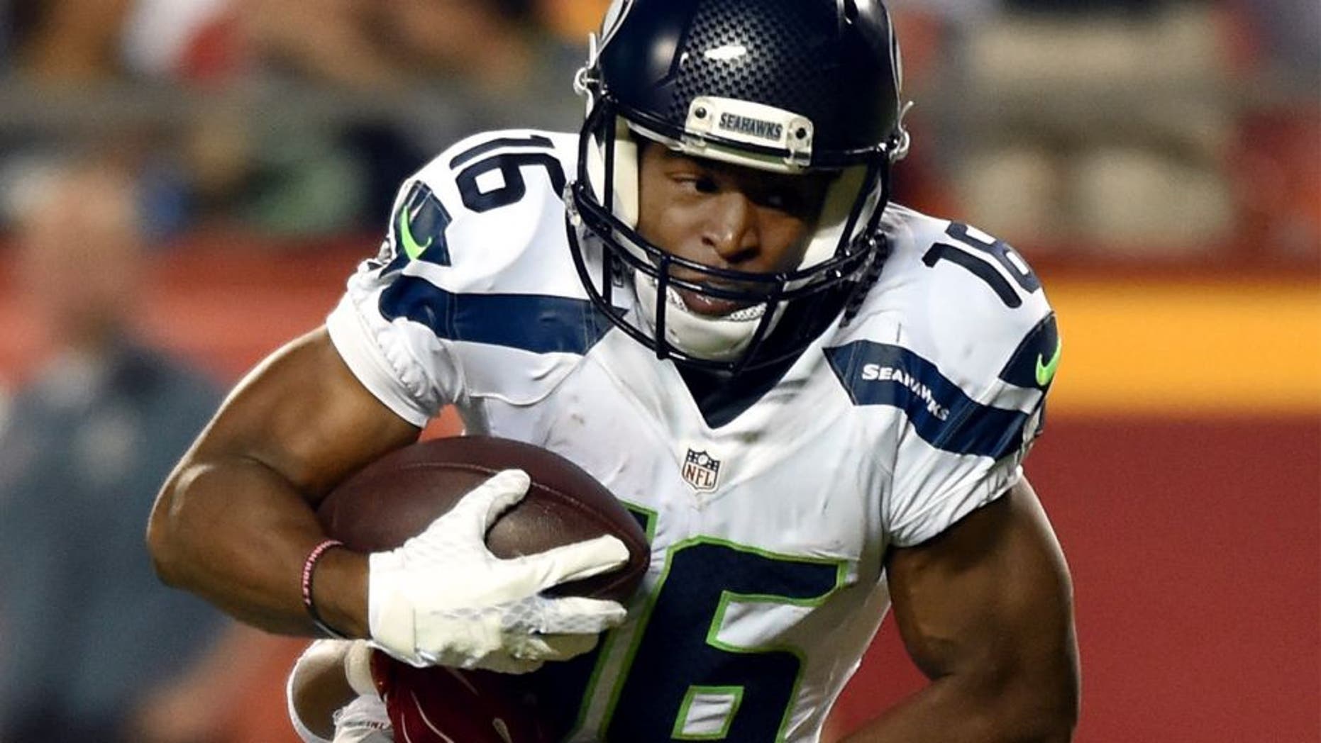 KANSAS CITY, MO - AUGUST 21: Wide receiver Tyler Lockett #16 of the Seattle Seahawks is tackled by cornerback Steven Nelson #20 of the Kansas City Chiefs defends during the preseason game at Arrowhead Stadium on August 21, 2015 in Kansas City, Missouri. (Photo by Peter Aiken/Getty Images)