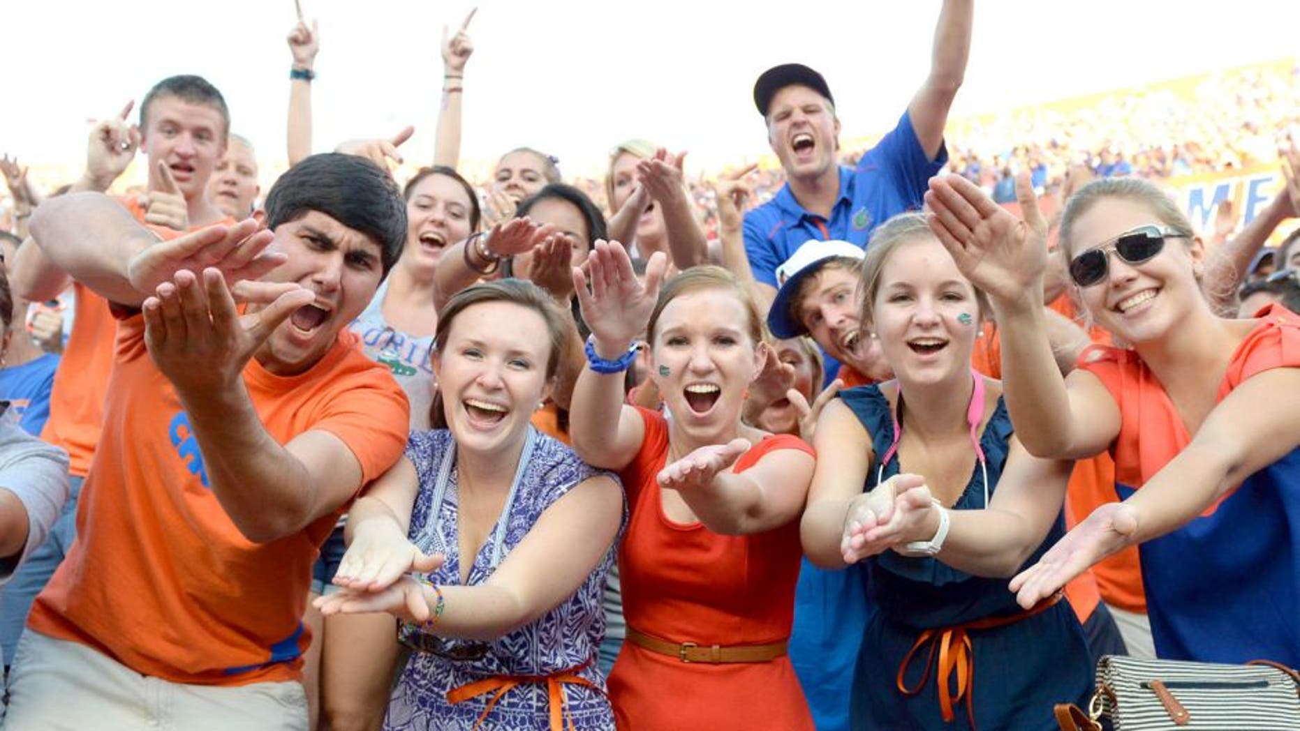 Oct 6, 2012; Gainesville, FL, USA; Florida Gators fans do the gator chomp during the fourth quarter against the LSU Tigers at Ben Hill Griffin Stadium. Mandatory Credit: Jake Roth-USA TODAY Sports