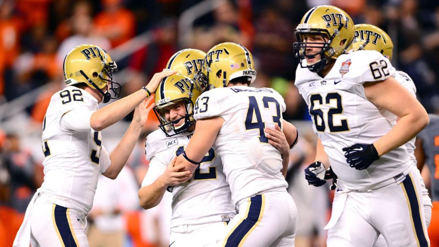 Dec 26, 2013; Detroit, MI, USA; Pittsburgh Panthers kicker Chris Blewitt (12) celebrates with teammates after kicking a field goal during the fourth quarter of the Little Caesars Pizza Bowl against the Bowling Green Falcons at Ford Field. Pittsburgh Panthers defeated Bowling Green Falcons 30-27. Mandatory Credit: Andrew Weber-USA TODAY Sports