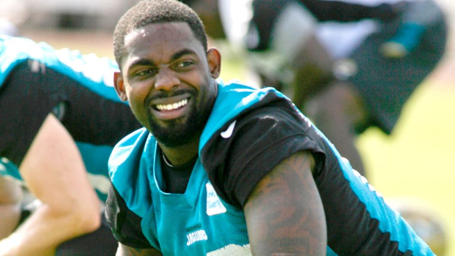 May 28, 2015; Jacksonville, FL, USA; Jacksonville Jaguars wide receiver Arrelious Benn (12) smiles as he stretches during OTAs at the Florida Blue Health and Wellness Practice Fields. Mandatory Credit: Phil Sears-USA TODAY Sports