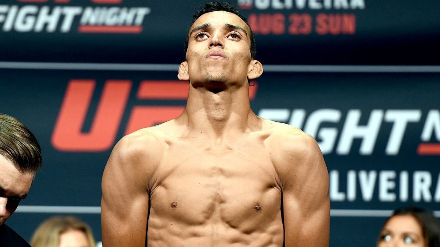SASKATOON, SK - AUGUST 22: Charles Oliveira of Brazil steps on the scale during the UFC weigh-in at the SaskTel Centre on August 22, 2015 in Saskatoon, Saskatchewan, Canada. (Photo by Jeff Bottari/Zuffa LLC/Zuffa LLC via Getty Images)