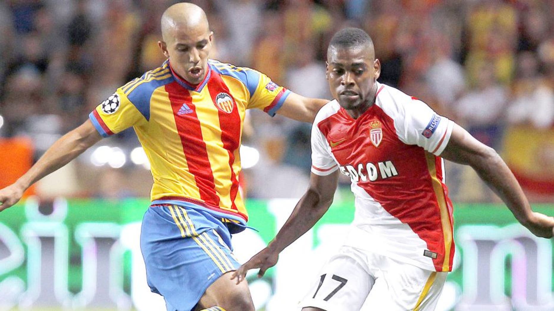 Valencia's French midfielder Sofiane Feghouli (L) vies with Monaco's Portuguese forward Ivan Cavaleiro (R) during the UEFA Champions League playoff football match between AS Monaco FC vs Valencia CF, at the Louis II Stadium, in Monaco, on August 25, 2015 . AFP PHOTO / JEAN CHRISTOPHE MAGNENET (Photo credit should read JEAN CHRISTOPHE MAGNENET/AFP/Getty Images)