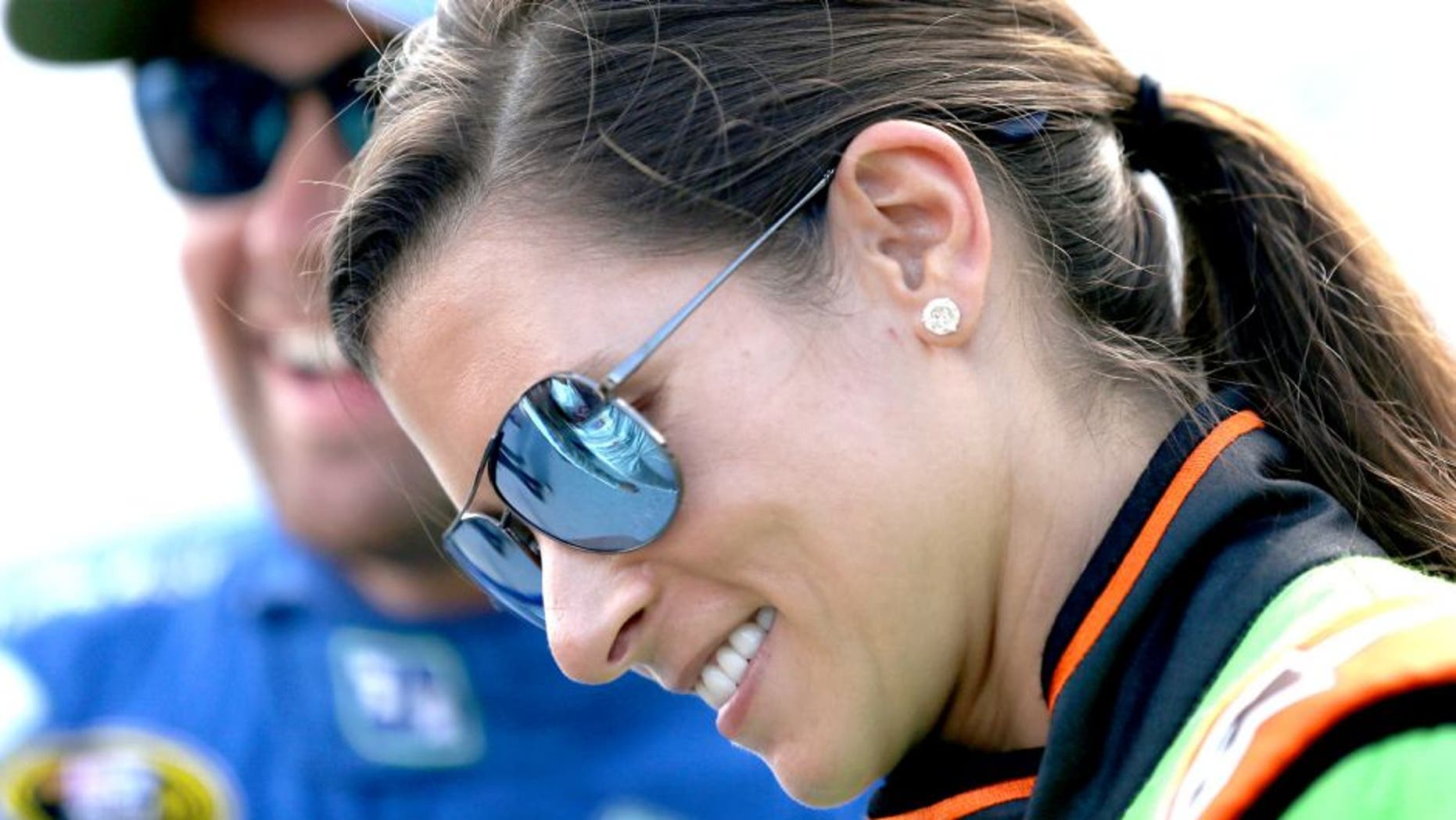 DAYTONA BEACH, FL - JULY 04: Danica Patrick, driver of the #10 GoDaddy Chevrolet, speaks with Ricky Stenhouse Jr., driver of the #17 Fifth Third Bank Ford, during qualifying for the NASCAR Sprint Cup Series Coke Zero 400 at Daytona International Speedway on July 4, 2015 in Daytona Beach, Florida. (Photo by Patrick Smith/Getty Images)