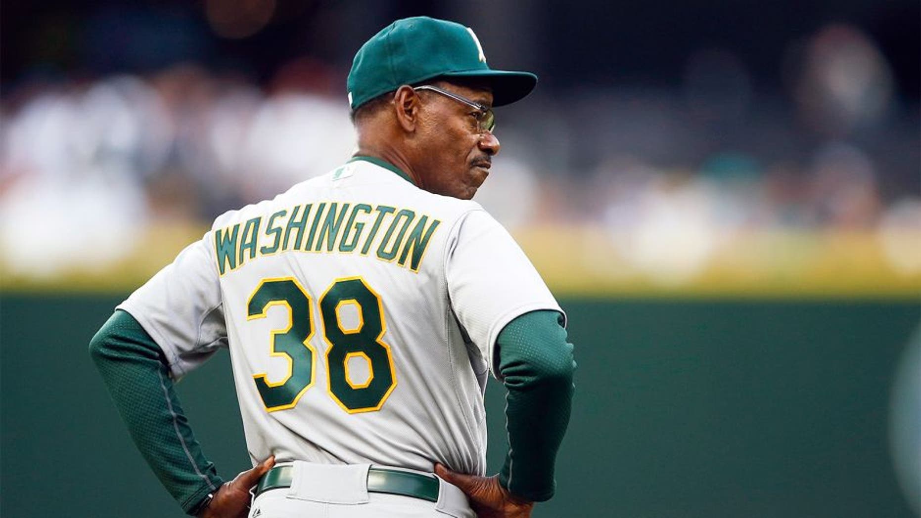 Aug 24, 2015; Seattle, WA, USA; Oakland Athletics third base coach Ron Washington (38) watches warmups before a game against the Seattle Mariners at Safeco Field. Mandatory Credit: Joe Nicholson-USA TODAY Sports