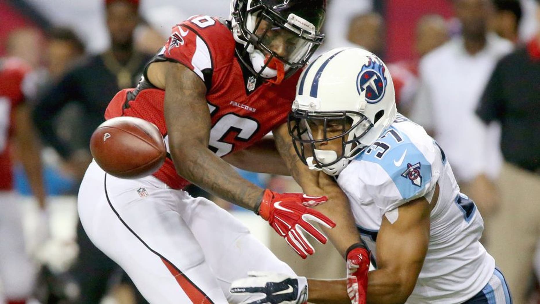 Aug 14, 2015; Atlanta, GA, USA; Tennessee Titans cornerback Cody Riggs (37) breaks up a pass intended for Atlanta Falcons wide receiver Justin Hardy (16) in the third quarter of their preseason NFL football game at Georgia Dome. Mandatory Credit: Jason Getz-USA TODAY Sports
