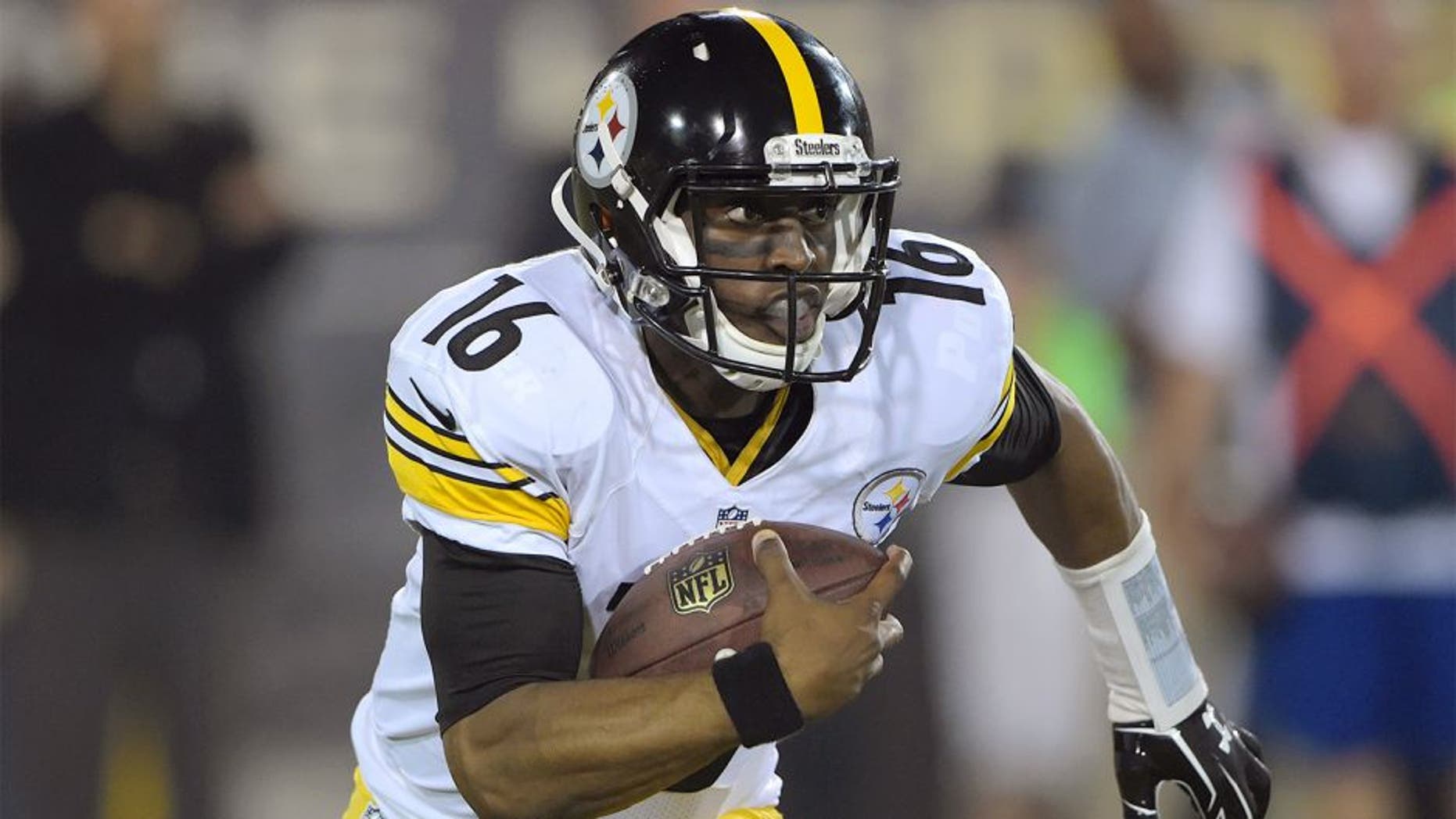 Aug 9, 2015; Canton, OH, USA; Pittsburgh Steelers receiver Tyler Murphy (16) carries the ball against the Minnesota Vikings in the 2015 Pro Football Hall of Fame game at Tom Benson Hall of Fame Stadium. Mandatory Credit: Kirby Lee-USA TODAY Sports
