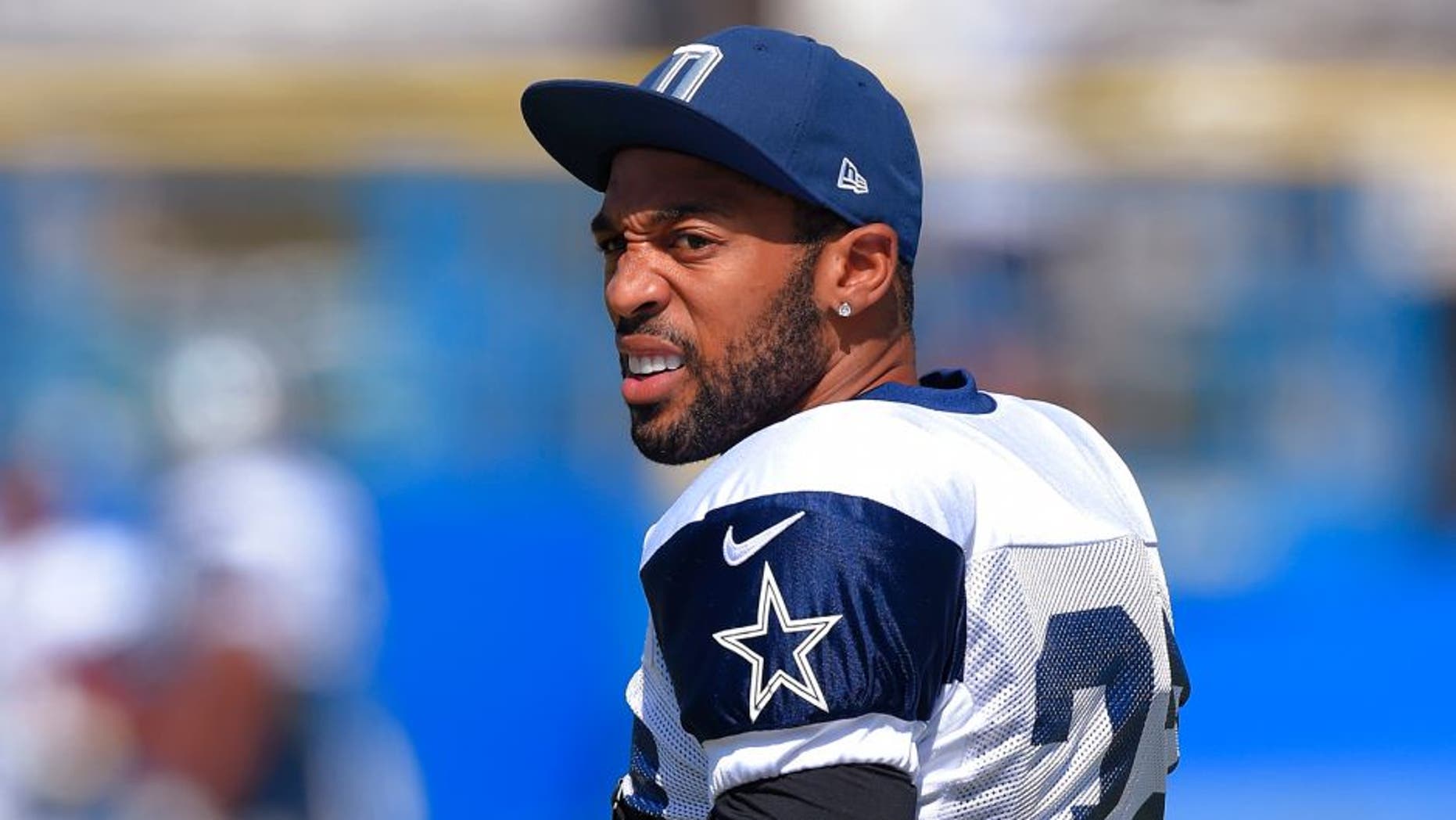 FILE - In this Aug. 18, 2015, file photo, Dallas Cowboys cornerback Orlando Scandrick walks onto the field during a joint NFL football training camp with the St. Louis Rams in Oxnard, Calif. Scandrick left practice at training camp with what he told his secondary coach he believed was a torn anterior cruciate ligament in his right knee. Scandrick went down working against rookie receiver Lucky Whitehead on Tuesday, Aug. 25, and was carted off the field. The Cowboys were awaiting results of an MRI. (AP Photo/Mark J. Terrill, File)