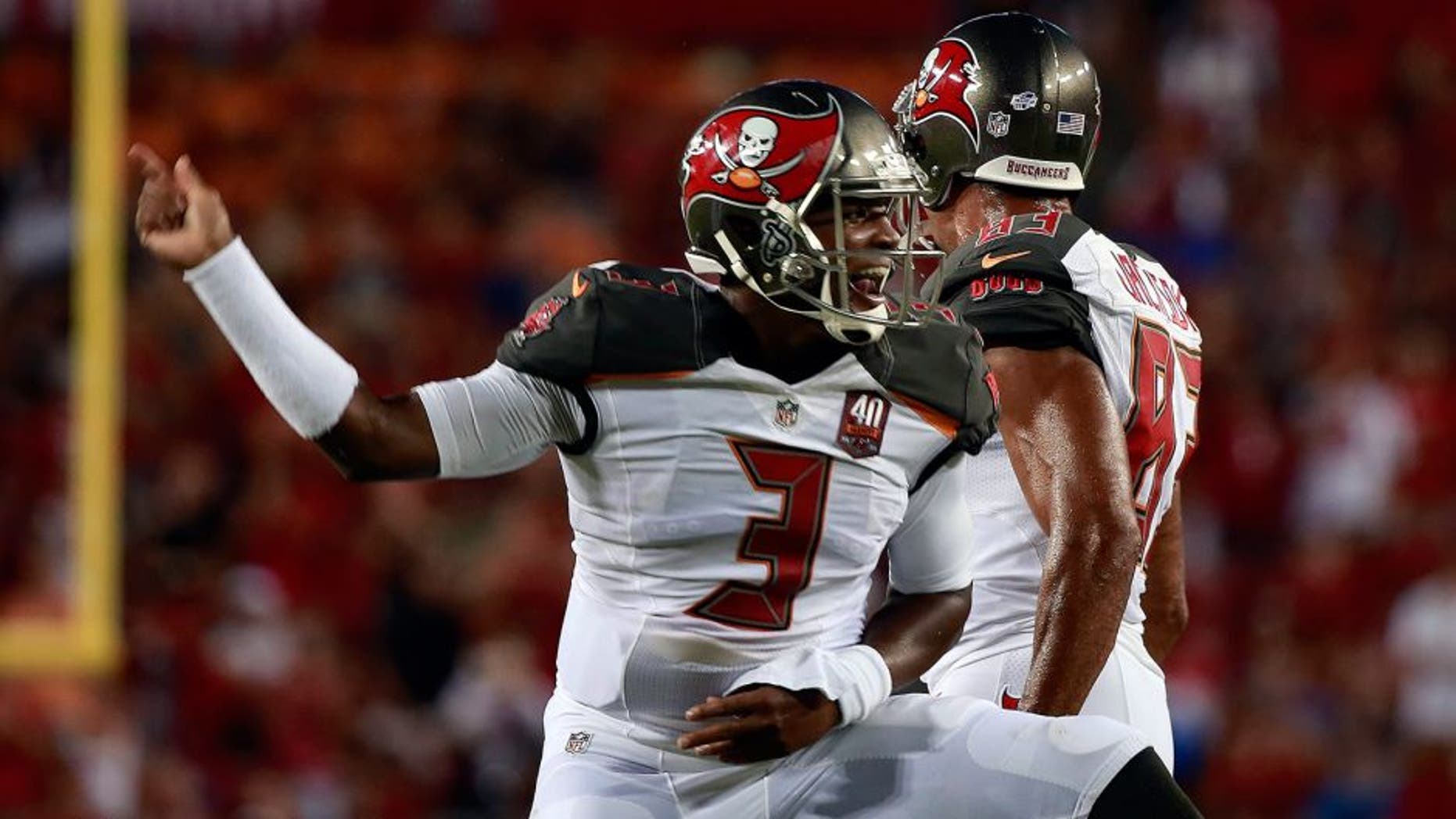 Aug 24, 2015; Tampa, FL, USA; Tampa Bay Buccaneers quarterback Jameis Winston (3) celebrates after he scored a touchdown against the Cincinnati Bengals during the first quarter at Raymond James Stadium. Mandatory Credit: Kim Klement-USA TODAY Sports