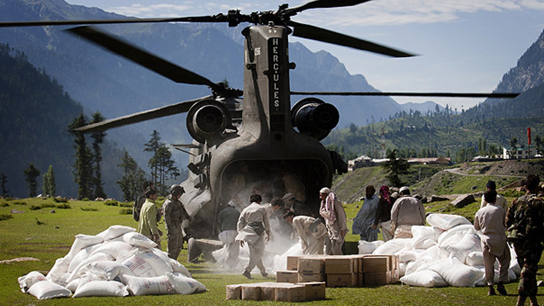 Aug. 20: Workers unload flood relief supplies from a U.S. helicopter in Kalam, in Pakistan's Swat Valley.