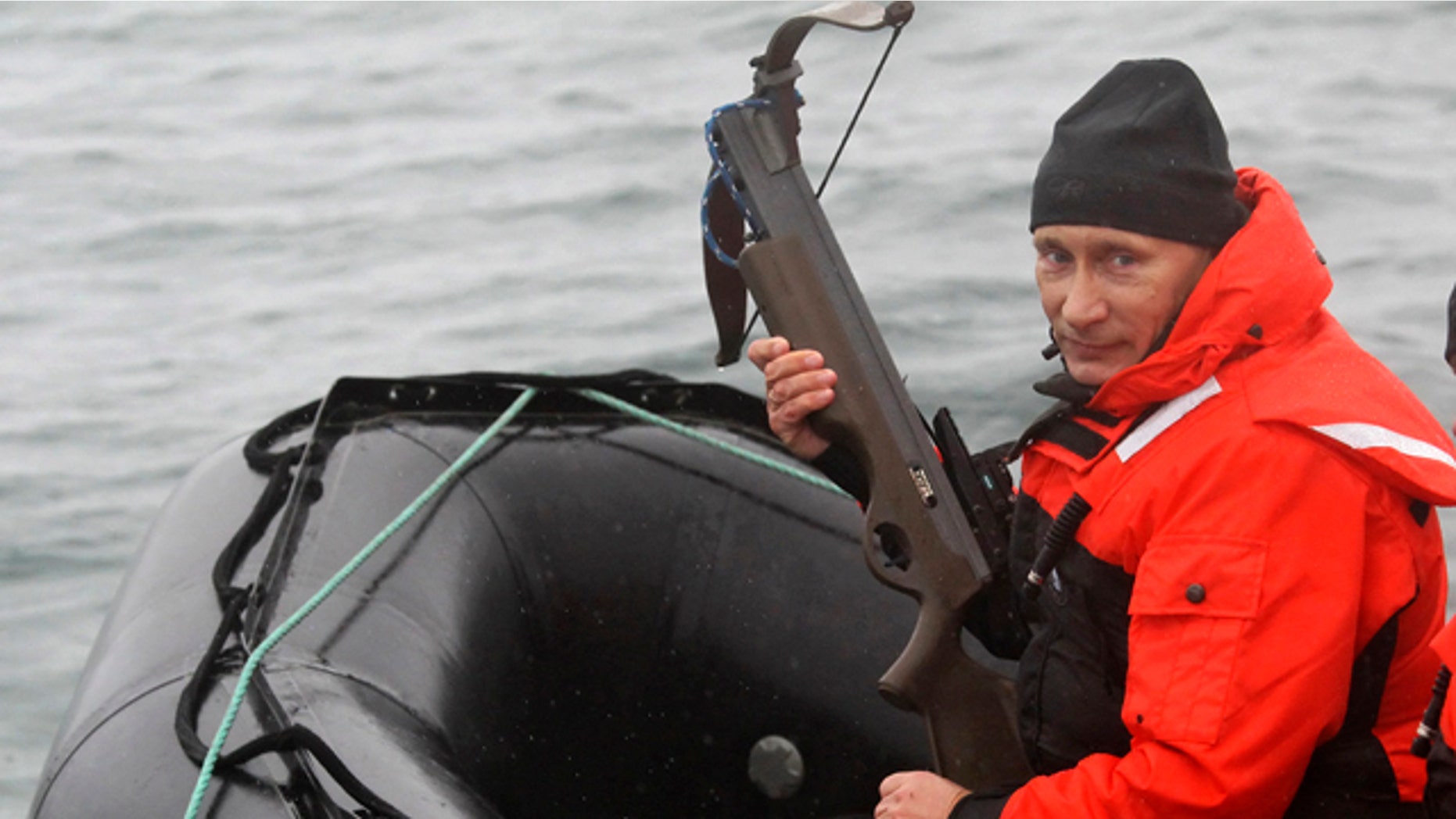 Aug. 25: Russian Prime Minister Vladimir Putin holds a crossbow as he sits on a rubber boat at the Olga Harbor of Kamchatka Peninsula during a scientific expedition.