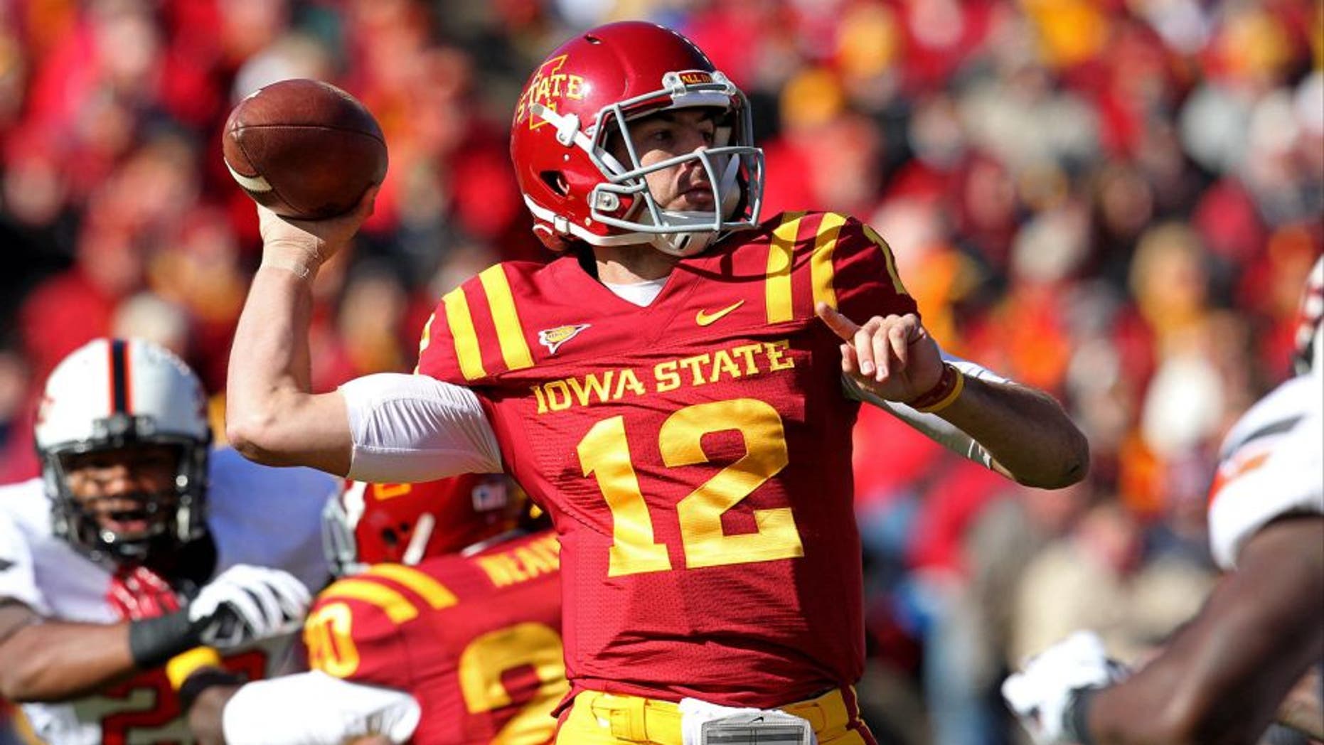 Oct 26, 2013; Ames, IA, USA; Iowa State Cyclones quarterback Sam B. Richardson (12) throws during the first quarter against the Oklahoma State Cowboys at Jack Trice Stadium. Mandatory Credit: Brace Hemmelgarn-USA TODAY Sports