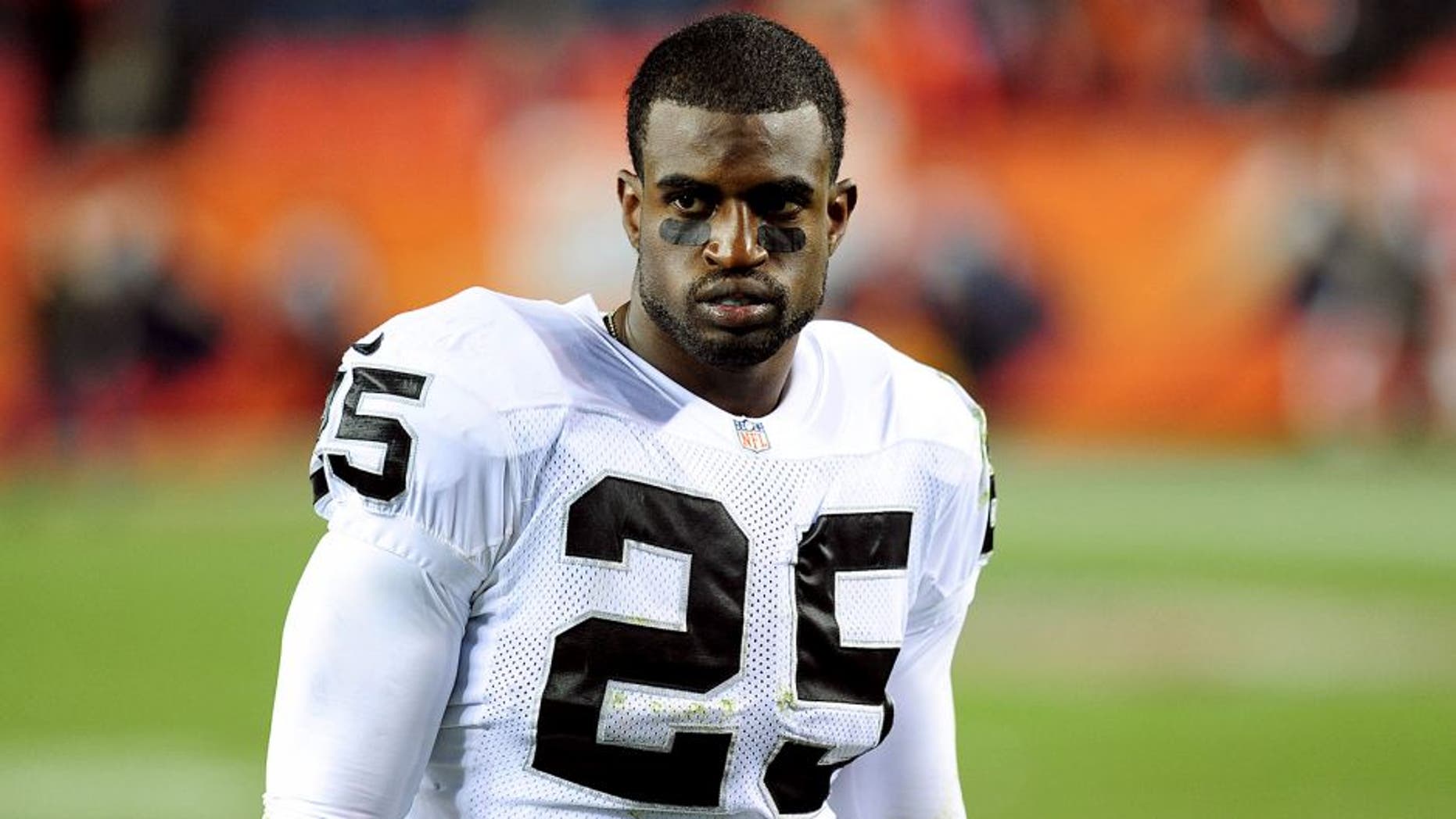 Sep 23, 2013; Denver, CO, USA; Oakland Raiders cornerback DJ Hayden (25) after the game against the Denver Broncos at Sports Authority Field at Mile High. The Broncos won 37-21. Mandatory Credit: Chris Humphreys-USA TODAY Sports