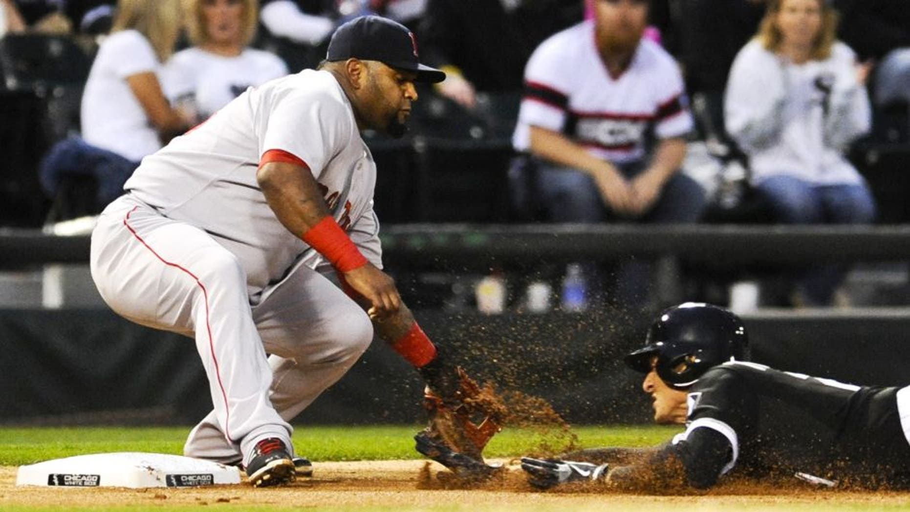Aug 25, 2015; Chicago, IL, USA; Chicago White Sox center fielder Trayce Thompson (28) triples under Boston Red Sox third baseman Pablo Sandoval (48) during the second inning at U.S Cellular Field. Mandatory Credit: Matt Marton-USA TODAY Sports