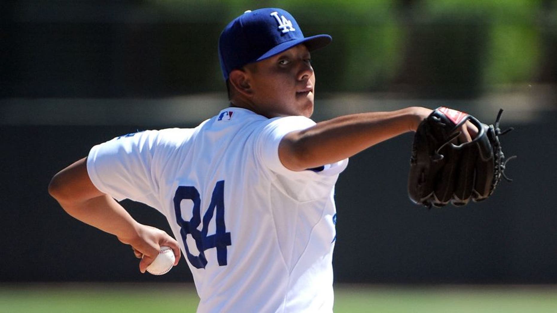 GLENDALE, AZ - MARCH 15: Julio Urias #84 of the Los Angeles Dodgers pitches against the San Diego Padres at Camelback Ranch on March 15, 2014 in Glendale, Arizona. (Photo by Lisa Blumenfeld/Getty Images)
