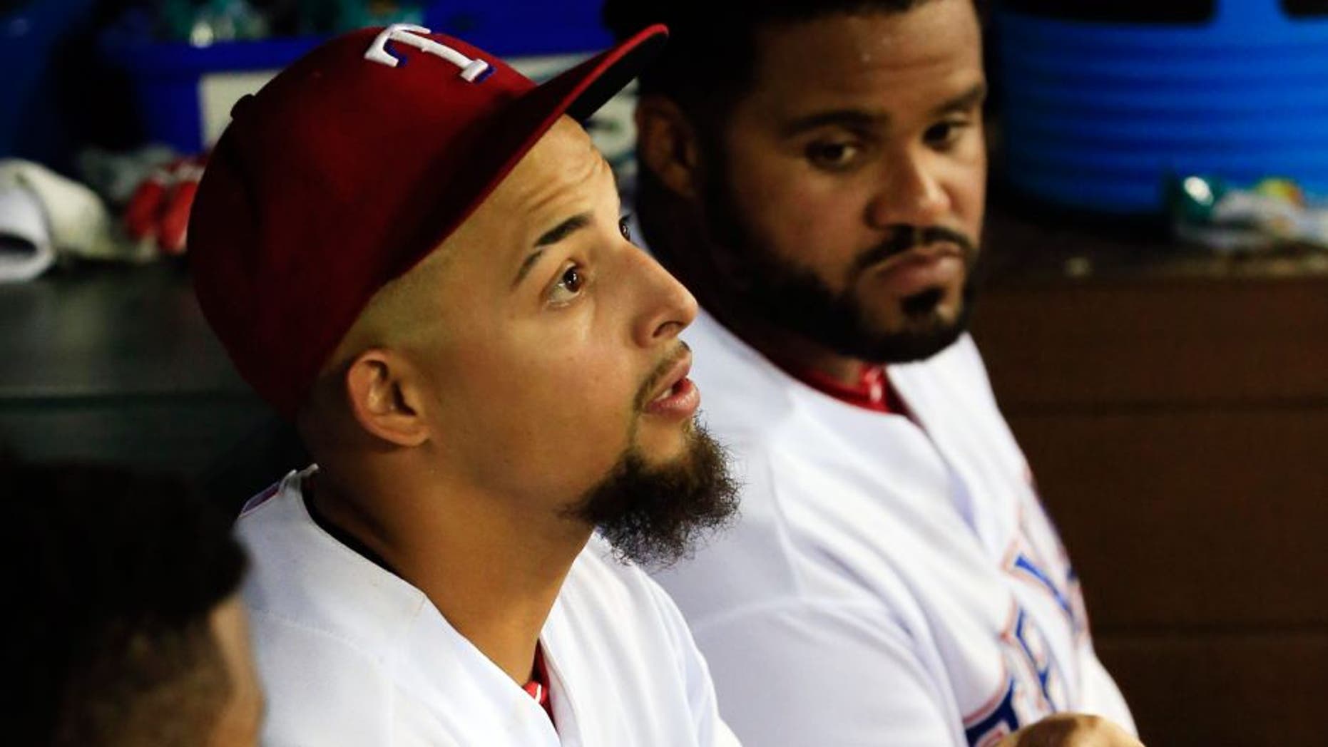 Aug 25, 2015; Arlington, TX, USA; Texas Rangers second baseman Rougned Odor (12) sits in the dugout with an injured hand during the game against the Toronto Blue Jays at Globe Life Park in Arlington. Mandatory Credit: Kevin Jairaj-USA TODAY Sports