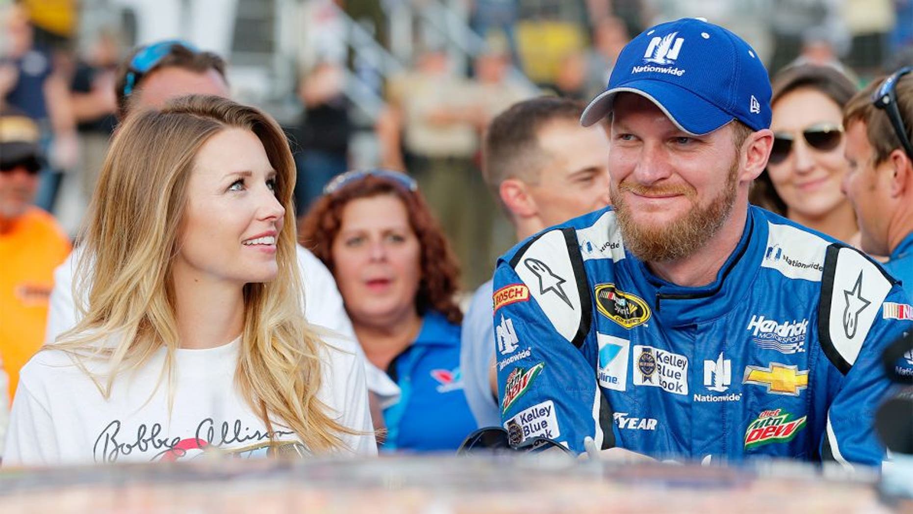 BRISTOL, TN - AUGUST 22: Dale Earnhardt Jr., driver of the #88 Nationwide Chevrolet, stands on the grid with his fiance, Amy Reimann, prior to the NASCAR Sprint Cup Series IRWIN Tools Night Race at Bristol Motor Speedway on August 22, 2015 in Bristol, Tennessee. (Photo by Brian Lawdermilk/Getty Images)