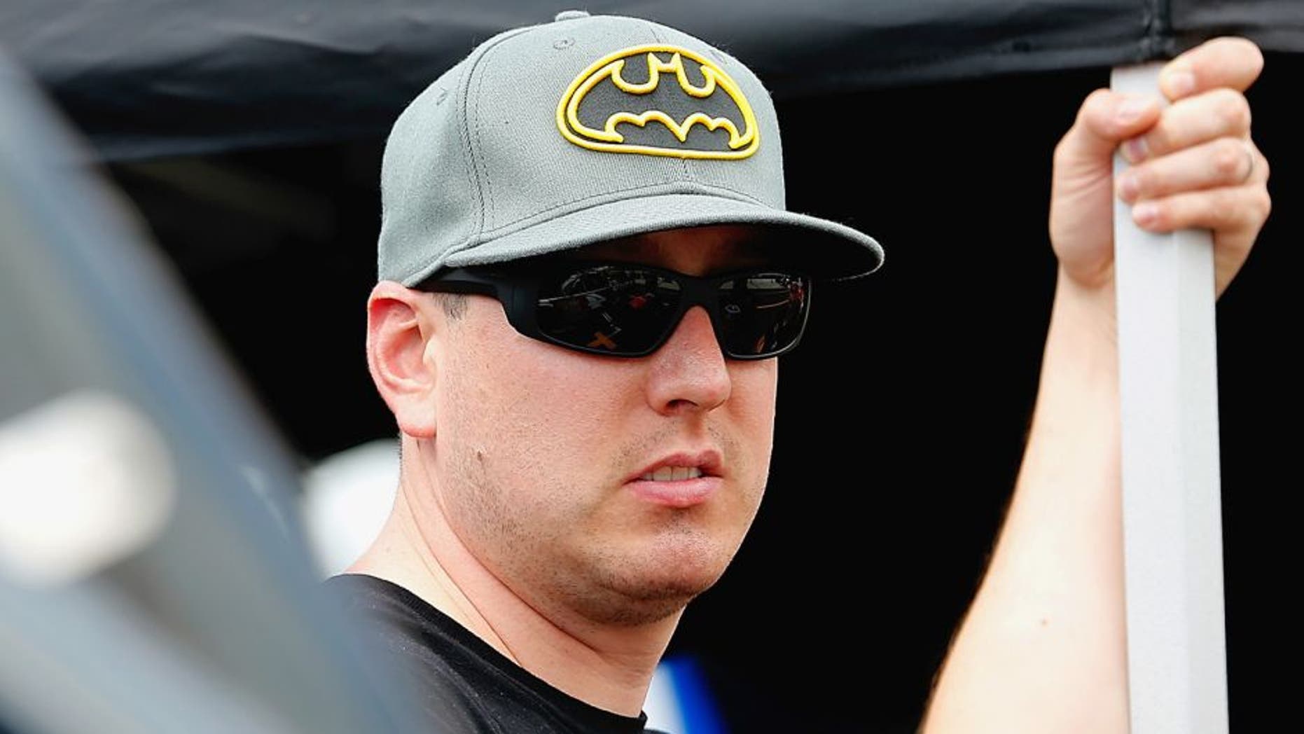 BRISTOL, TN - AUGUST 18: Kyle Busch, driver of the #54 JEGS Toyota, stands in the garage during practice for the NASCAR Camping World Truck Series UNOH 200 race at Bristol Motor Speedway on August 18, 2015 in Bristol, Tennessee. (Photo by Brian Lawdermilk/NASCAR via Getty Images)