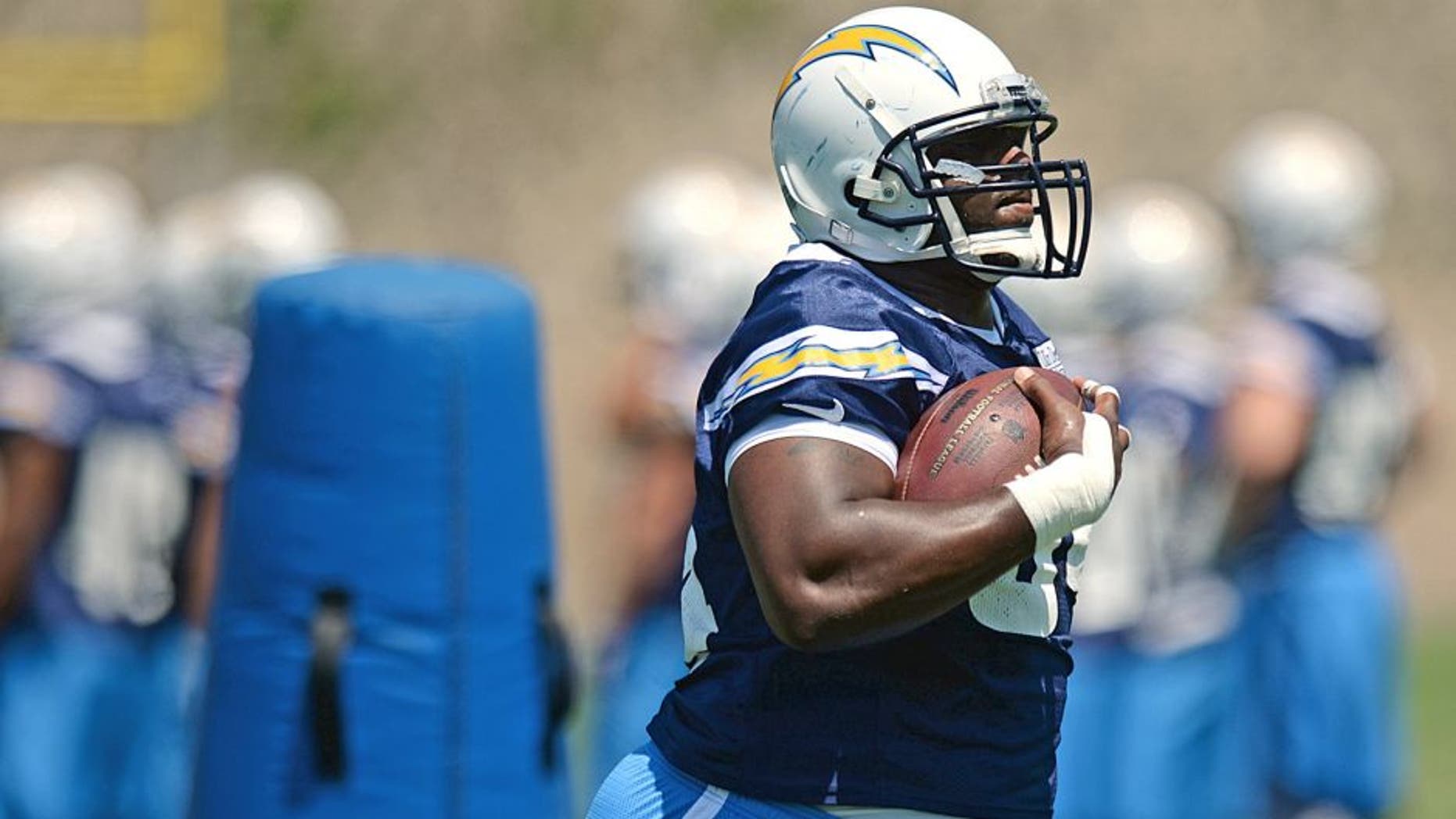 Jun 16, 2015; San Diego, CA, USA; San Diego Chargers defensive end Corey Liuget (94) participates in a drill during minicamp at Charger Park. Mandatory Credit: Jake Roth-USA TODAY Sports
