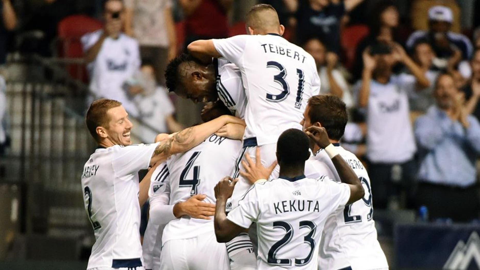 Aug 26, 2015; Vancouver, British Columbia, Canada; Vancouver Whitecaps defender Tim Parker (26) celebrates his goal against Montreal Impact goalkeeper Eric Kronberg (not pictured) during the second half at BC Place. The Vancouver Whitecaps won 2-0. Mandatory Credit: Anne-Marie Sorvin-USA TODAY Sports
