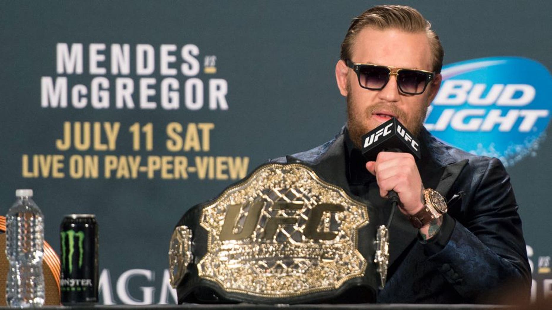 LAS VEGAS, NV - JULY 11: UFC interim featherweight champion Conor McGregor interacts with the media during the UFC 189 post fight press conference at the MGM Grand Garden Arena on July 11, 2015 in Las Vegas, Nevada. (Photo by Jeff Bottari/Zuffa LLC/Zuffa LLC via Getty Images)