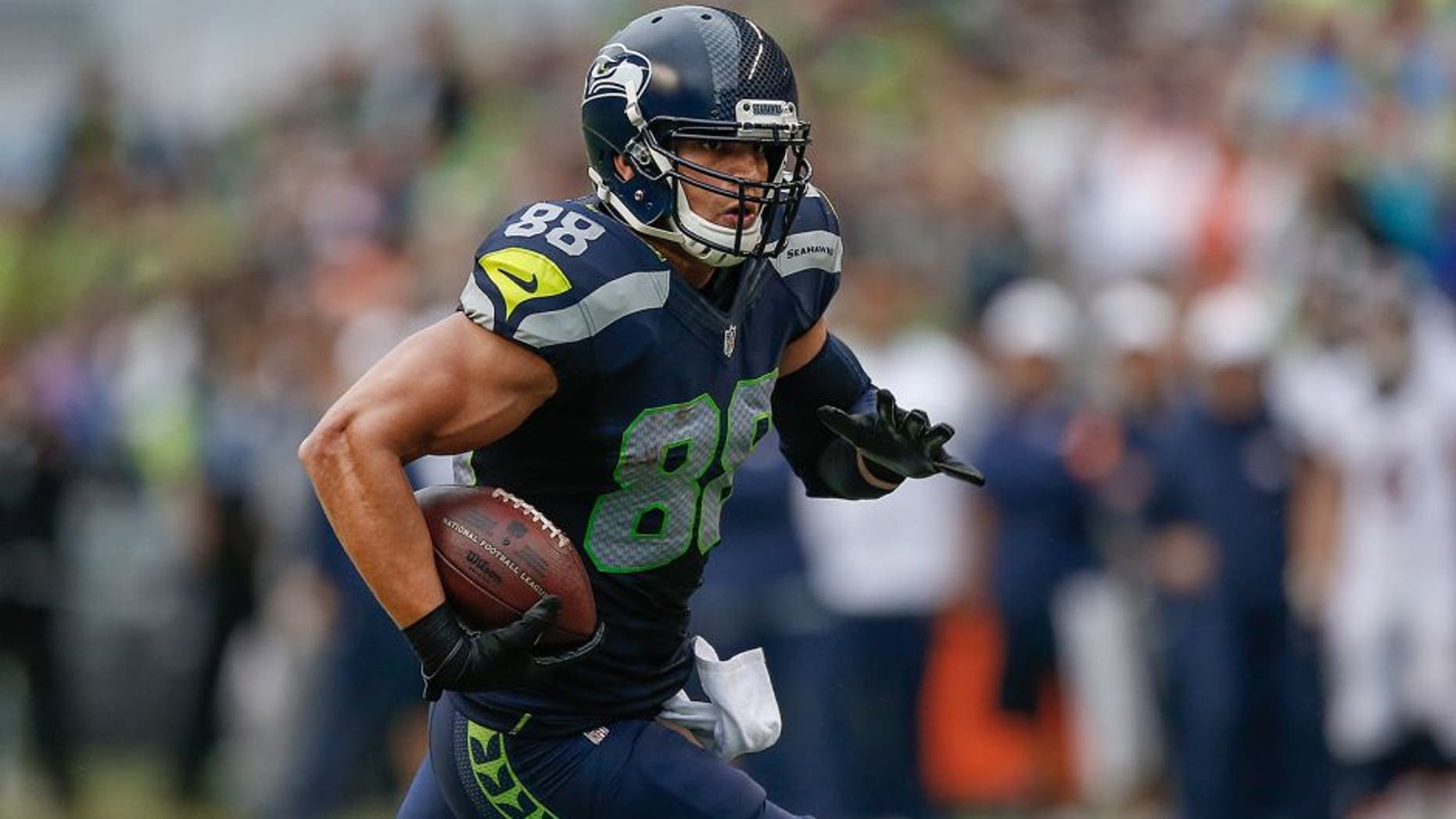 SEATTLE, WA - AUGUST 14: Tight end Jimmy Graham #88 of the Seattle Seahawks rushes against the Denver Broncos at CenturyLink Field on August 14, 2015 in Seattle, Washington. (Photo by Otto Greule Jr/Getty Images)