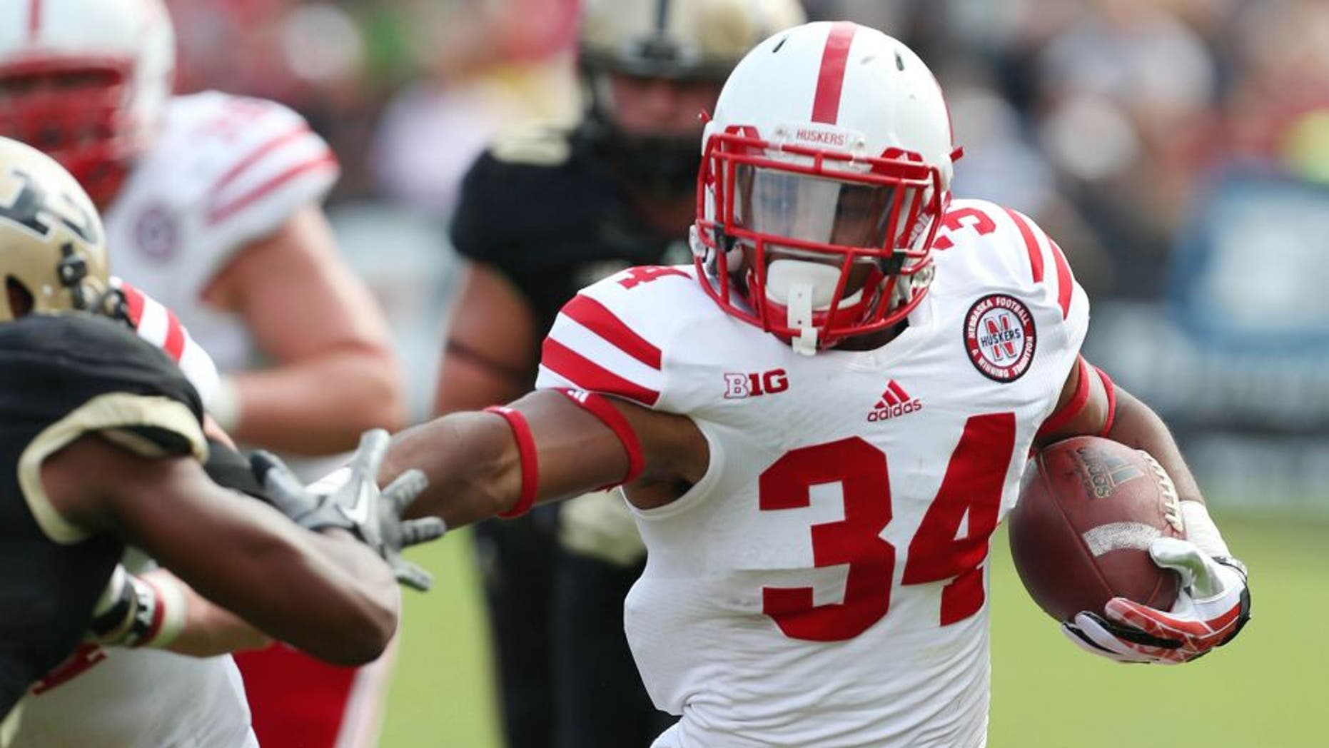 Oct 12, 2013; West Lafayette, IN, USA; Nebraska Cornhuskers running back Terrell Newby (34) runs with the ball against the Purdue Boilermakers at Ross Ade Stadium. Nebraska defeats Purdue 44-7. Mandatory Credit: Brian Spurlock-USA TODAY Sports