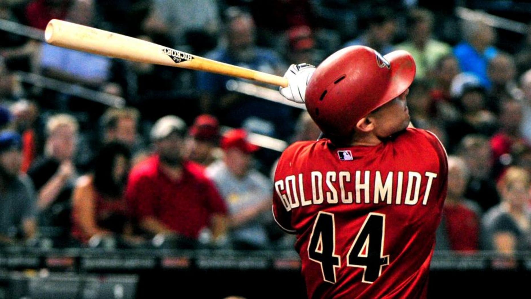 Aug 26, 2015; Phoenix, AZ, USA; Arizona Diamondbacks first baseman Paul Goldschmidt (44) hits a solo home run during the first inning against the St. Louis Cardinals at Chase Field. Mandatory Credit: Matt Kartozian-USA TODAY Sports