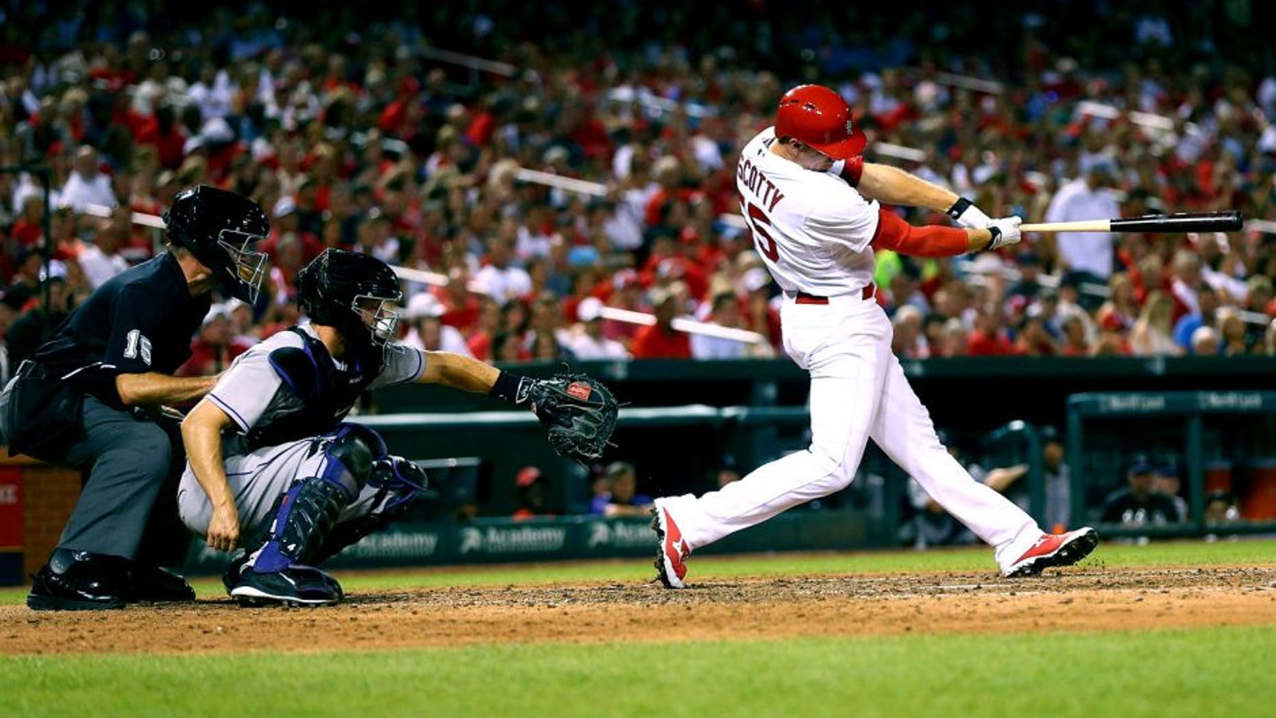 ST. LOUIS, MO - JULY 31: Stephen Piscotty #55 of the St. Louis Cardinals hits a two-RBI double against the Colorado Rockies in the sixth inning at Busch Stadium on July 31, 2015 in St. Louis, Missouri. (Photo by Dilip Vishwanat/Getty Images)