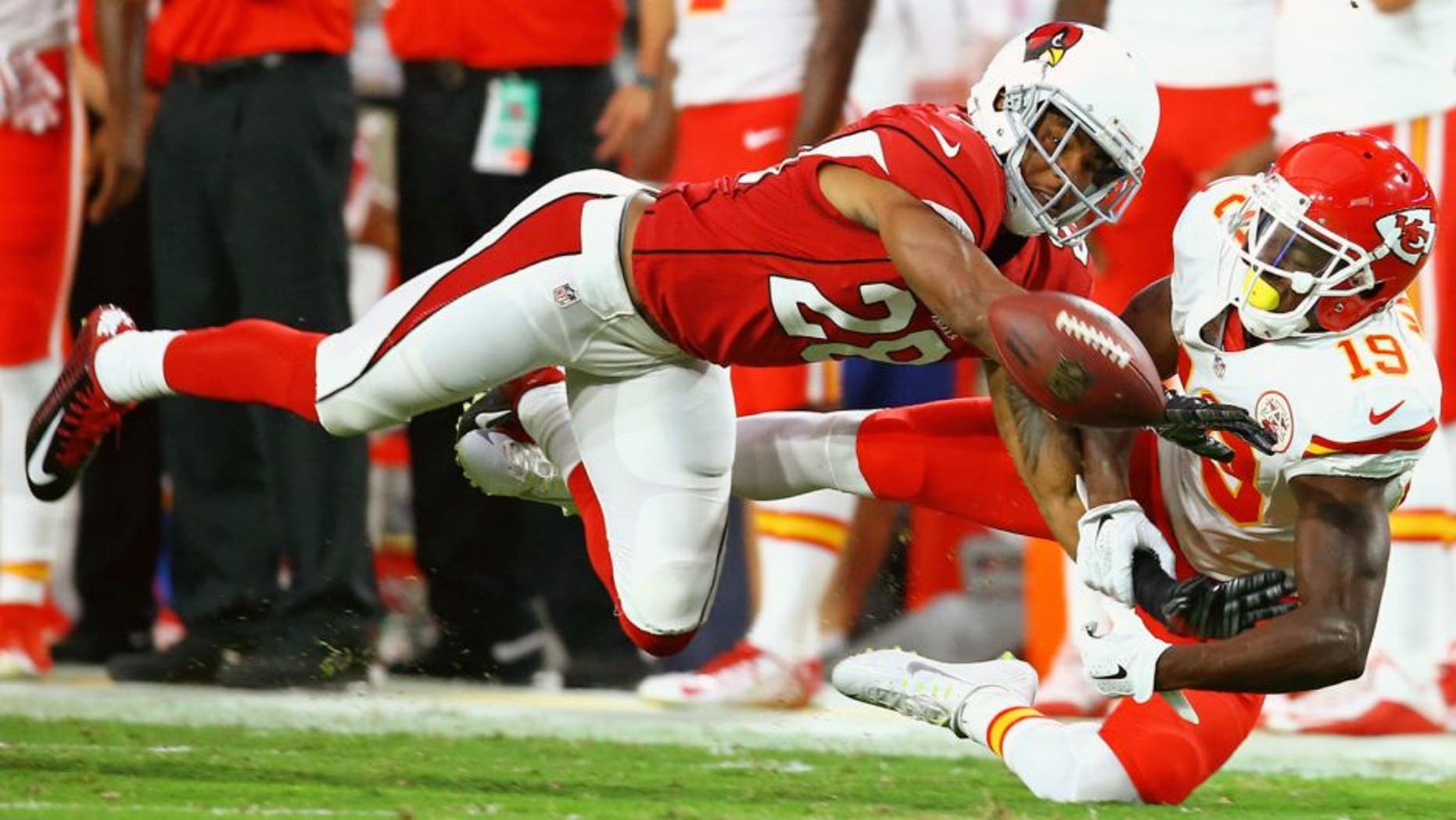 Aug 15, 2015; Glendale, AZ, USA; Arizona Cardinals cornerback Justin Bethel (28) breaks up a pass intended for Kansas City Chiefs wide receiver Jeremy Maclin (19) in a preseason NFL football game at University of Phoenix Stadium. Mandatory Credit: Mark J. Rebilas-USA TODAY Sports